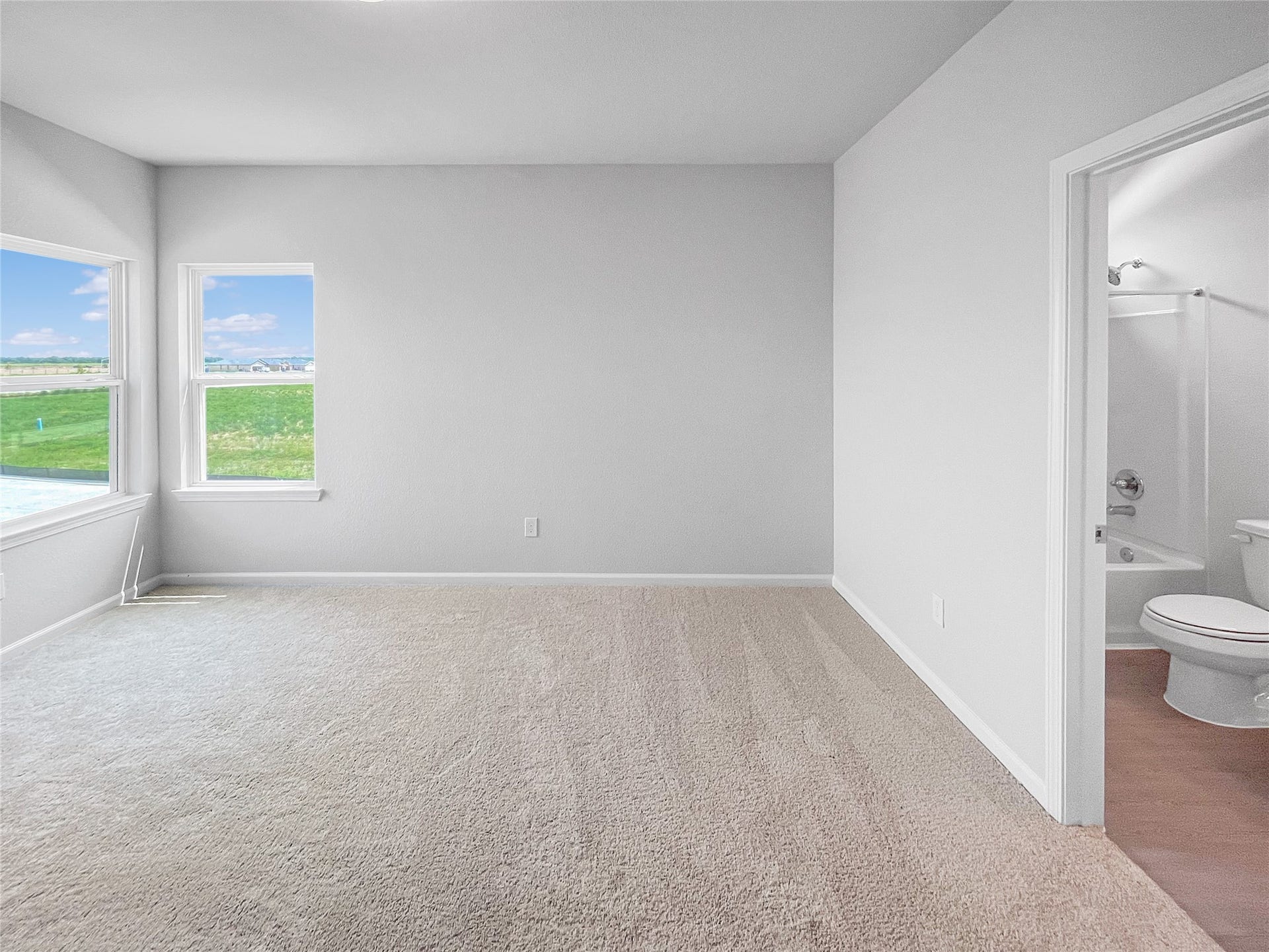 3442 Brushy Marsh Drive, Richmond, TX 77406 The Waring III- Upstairs Bedroom with En Suite. Sample image for illustration; upgrades, options, and colors may vary.