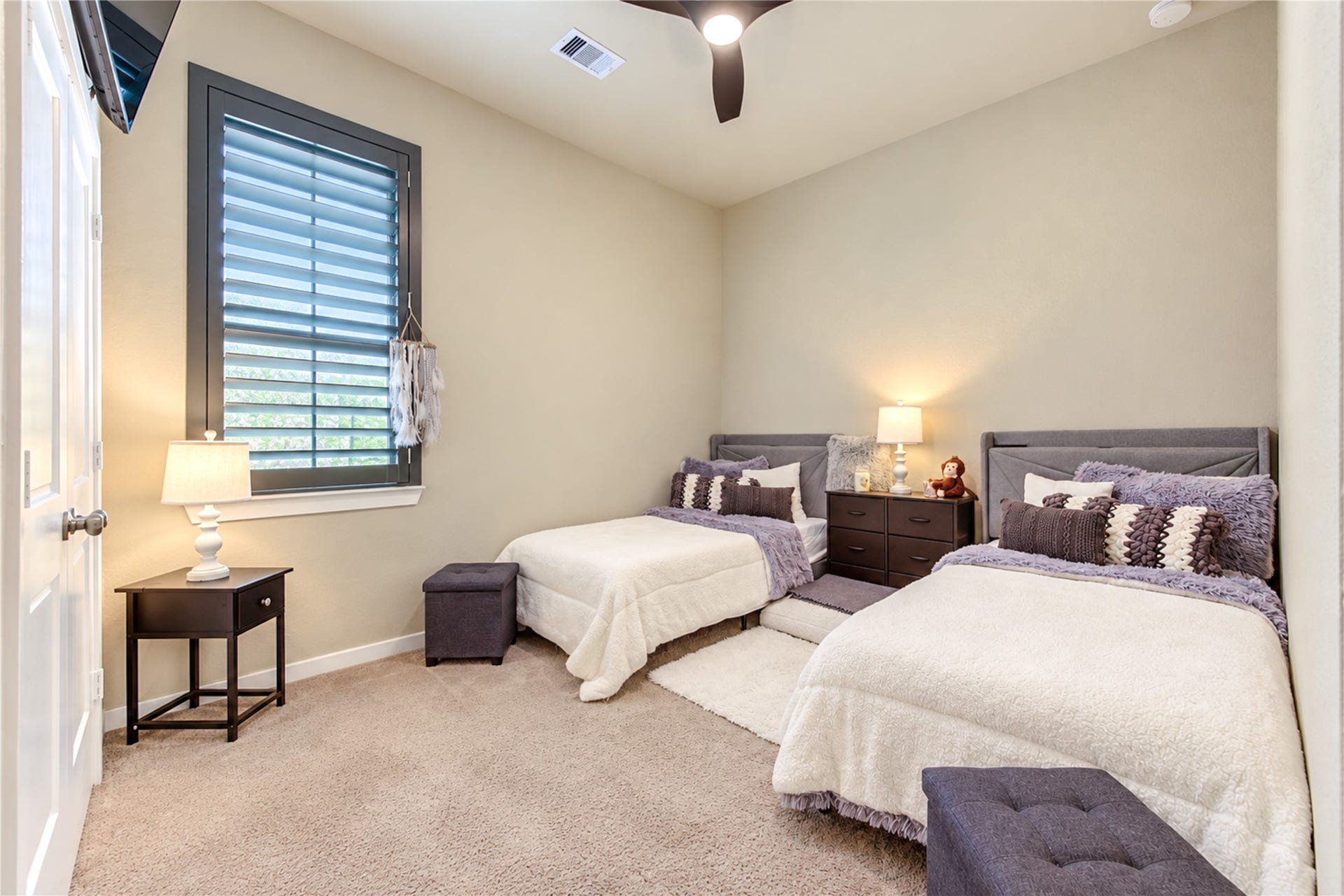 24911 Via Arabella Lane, Richmond, TX 77406 A comfortable secondary bedroom with high ceilings, soft carpeting and a window with plantation shutters.