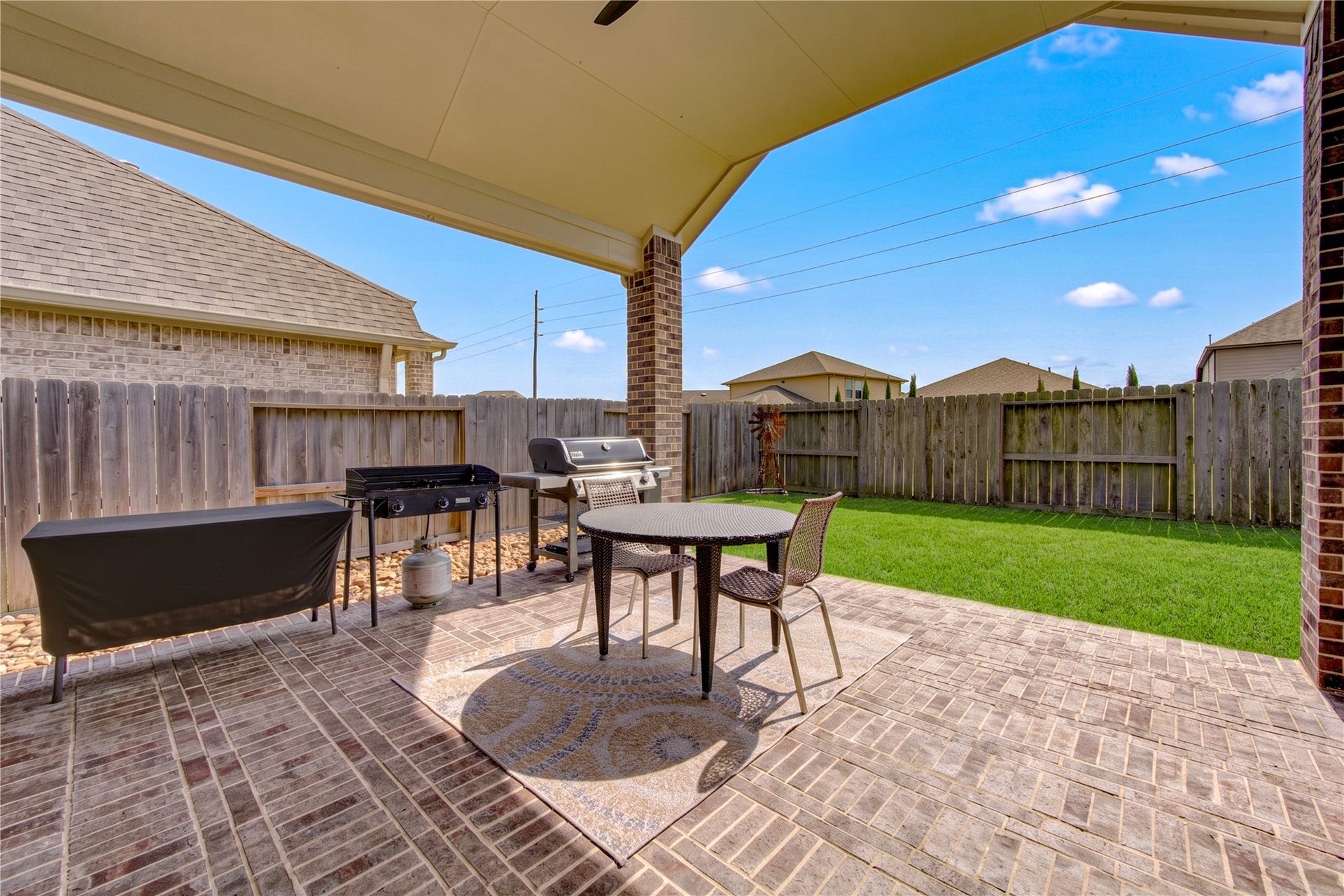 24911 Via Arabella Lane, Richmond, TX 77406 A covered patio offers a comfortable outdoor space for relaxing or casual entertaining.