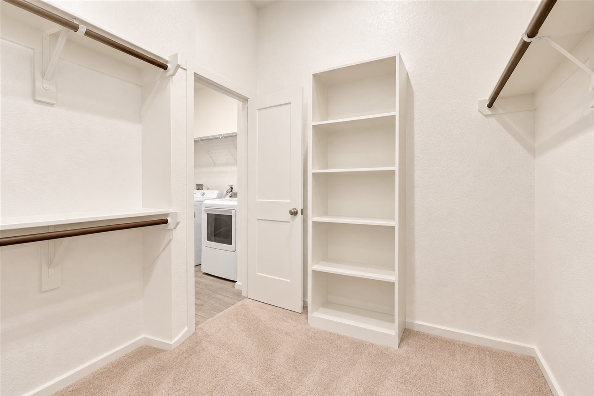 24911 Via Arabella Lane, Richmond, TX 77406 A generous walk-in closet with built-in shelving and hanging space, plus convenient direct access to the utility room.
