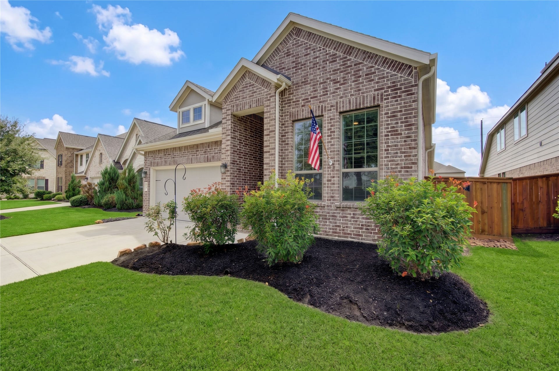 24911 Via Arabella Lane, Richmond, TX 77406 A closer look at the home's attractive brick exterior, welcoming entry and well-maintained landscaping.