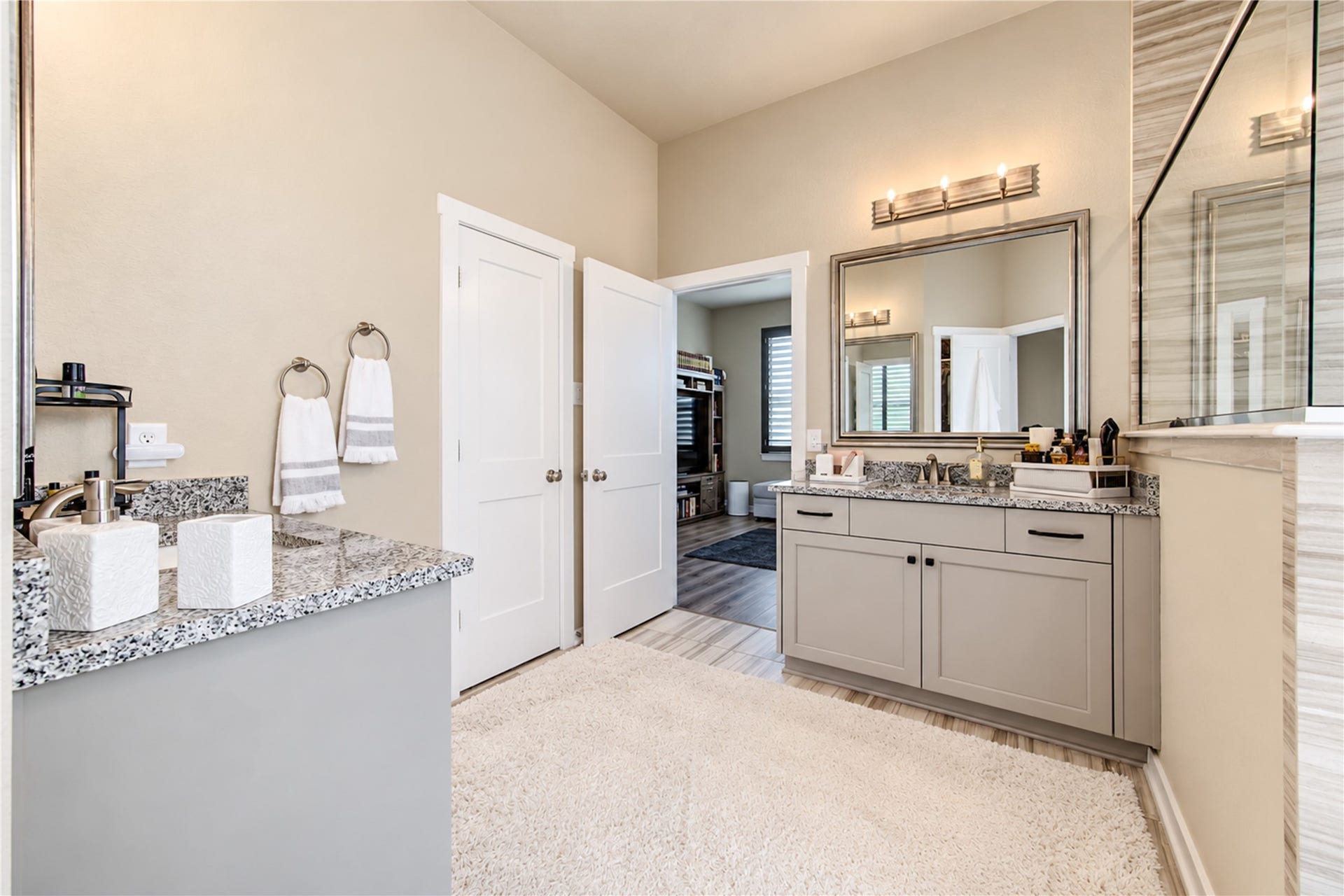 24911 Via Arabella Lane, Richmond, TX 77406 The primary bathroom offers generous counter space, separate vanities and attractive finishes throughout.