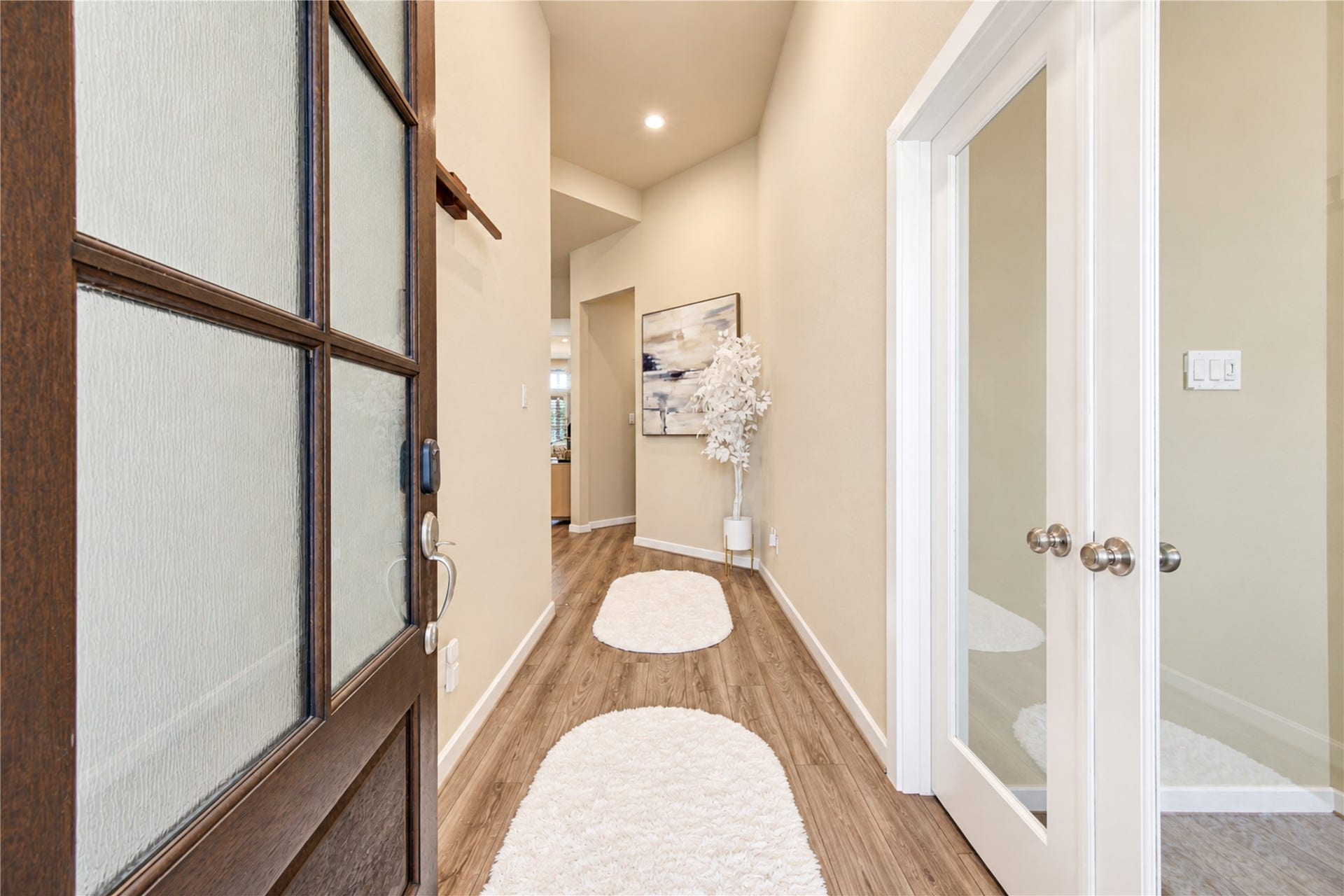 24911 Via Arabella Lane, Richmond, TX 77406 A welcoming entry with high ceilings, wood-look tile flooring and a private office just off the foyer.