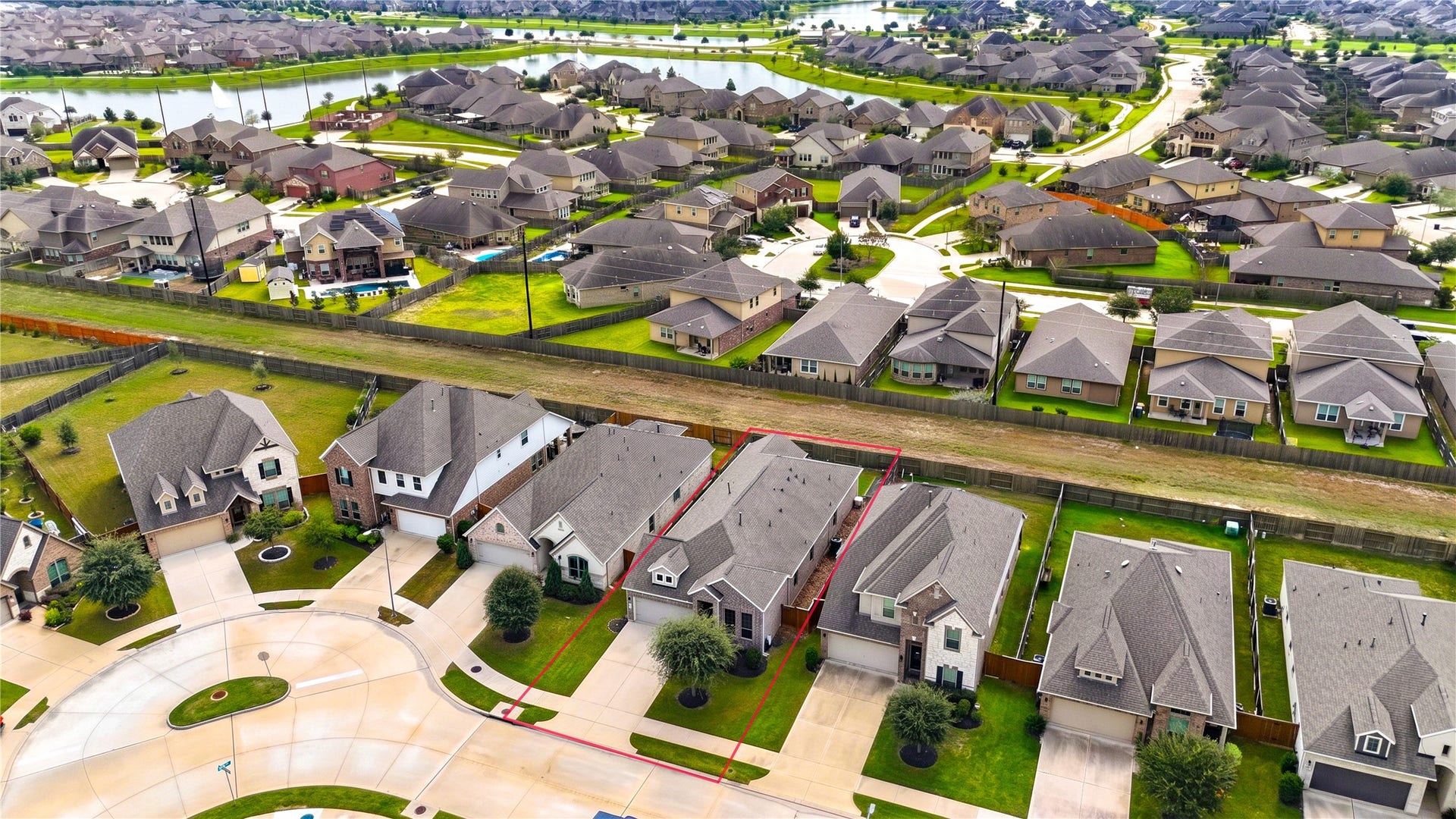 24911 Via Arabella Lane, Richmond, TX 77406 A wider perspective of the surrounding neighborhood, with established residential streets and nearby green spaces.
