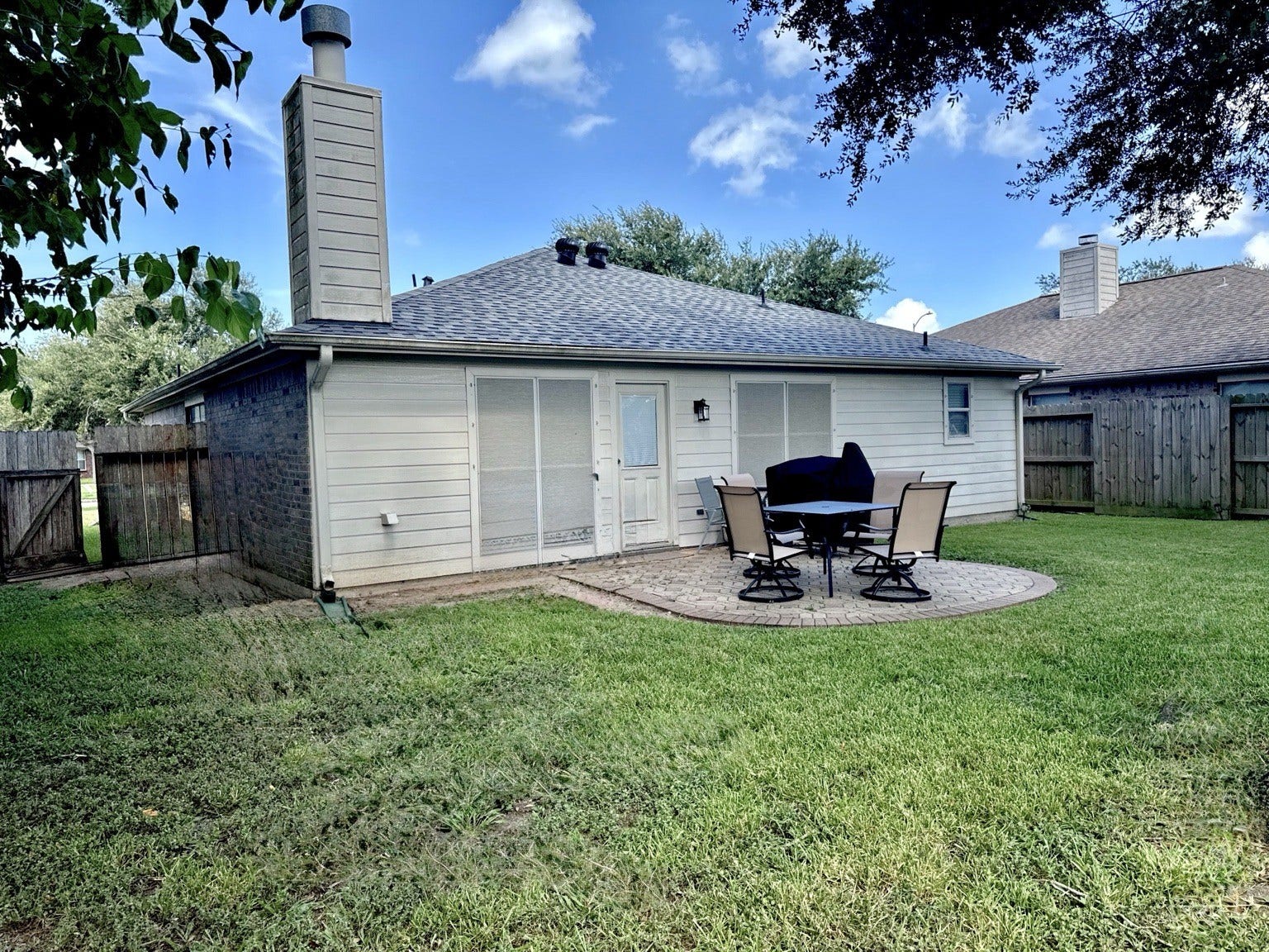 5427 Chase Wood Drive, Bacliff, TX 77518 Backyard patio for outdoor dining and entertainment