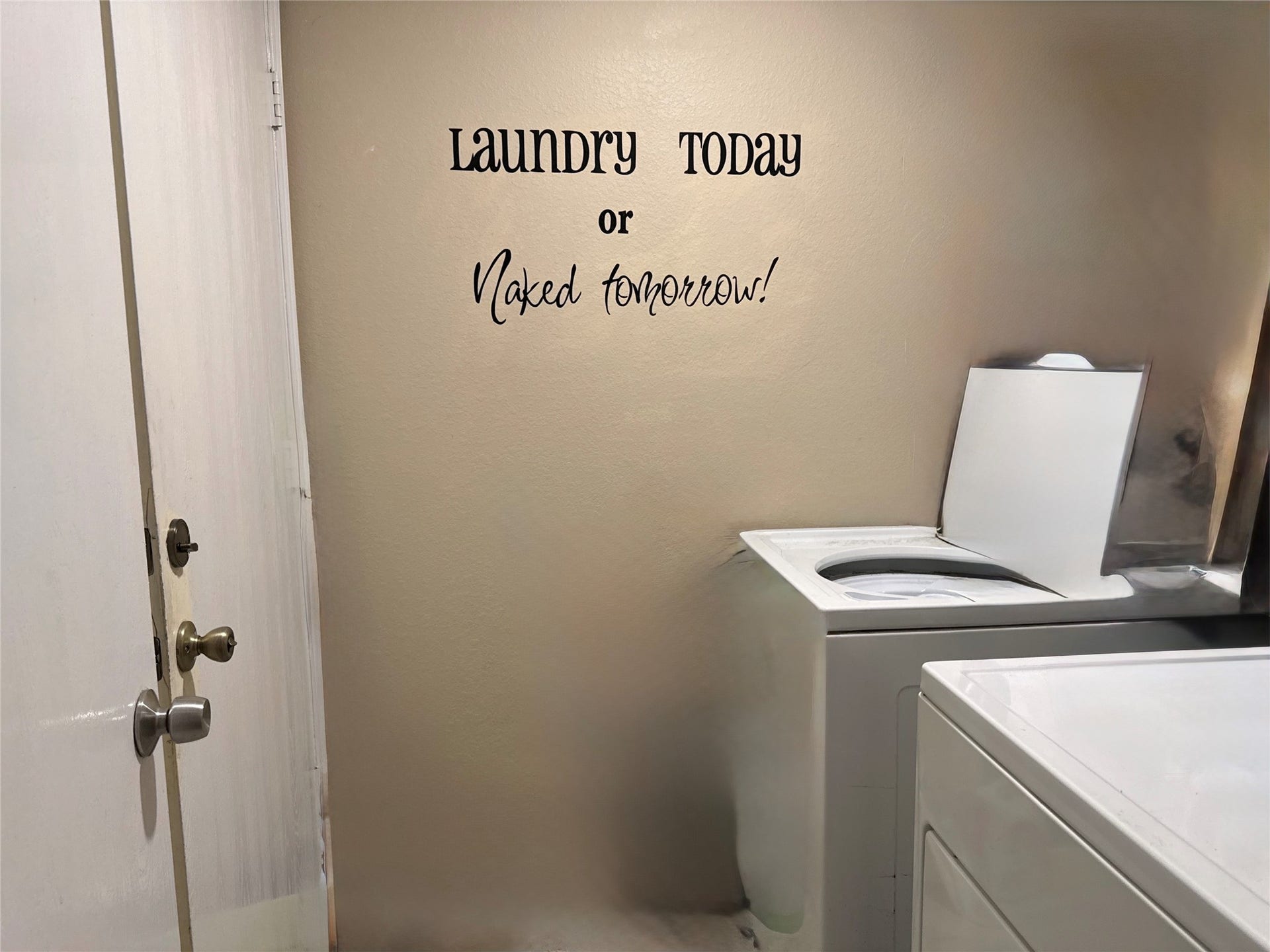 5427 Chase Wood Drive, Bacliff, TX 77518 Dedicated laundry room with included washer and dryer provides convenient access to the two-car garage.