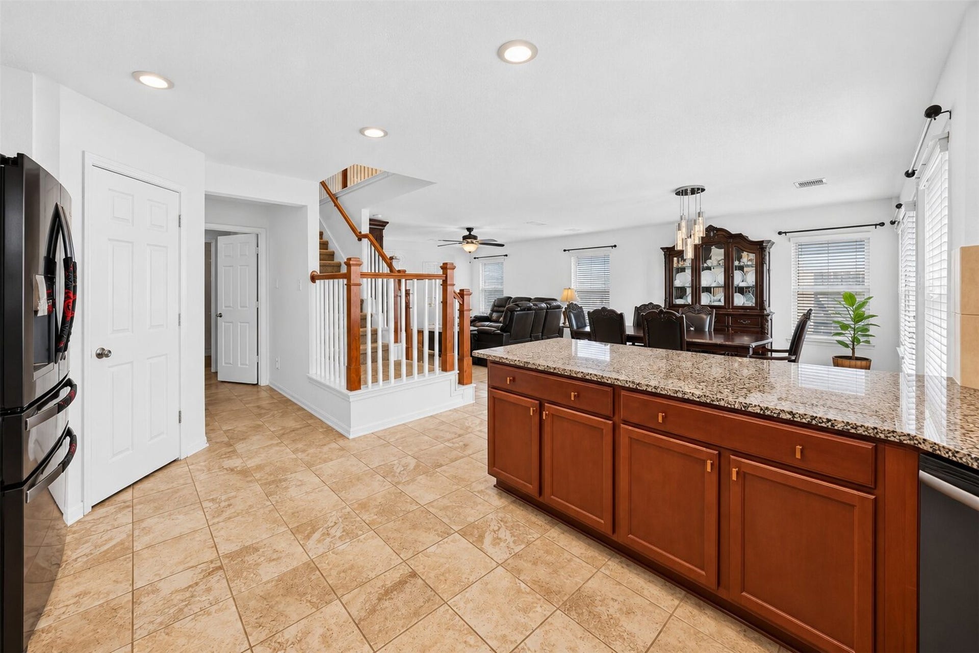 2627 White Bluff Lane, Houston, TX 77038 view from kitchen into dining room and staris leading to 2nd floor