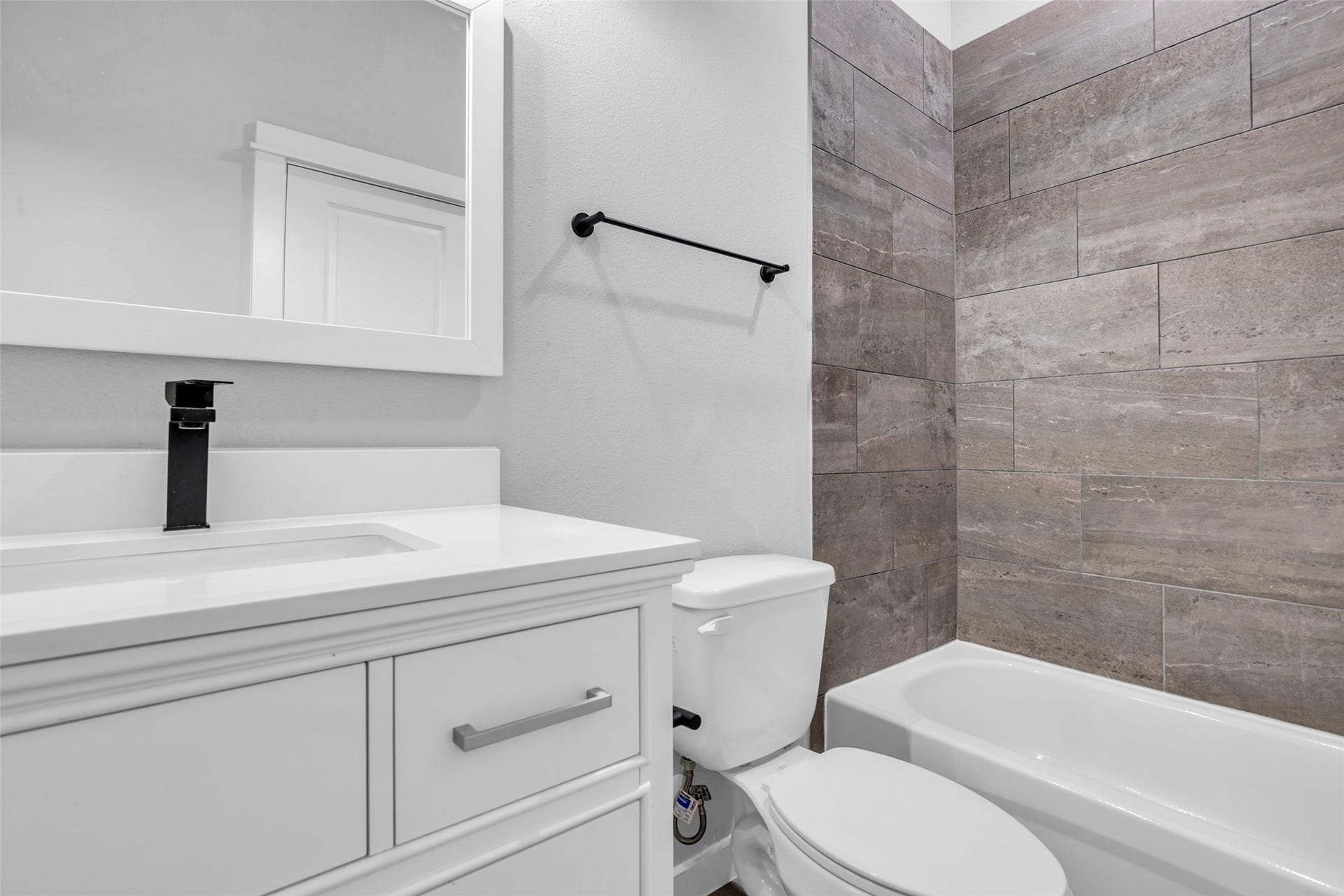 8474 Berry Green Lane, Houston, TX 77022 A hall bath with a tub/shower combo, conveniently near the secondary bedrooms.