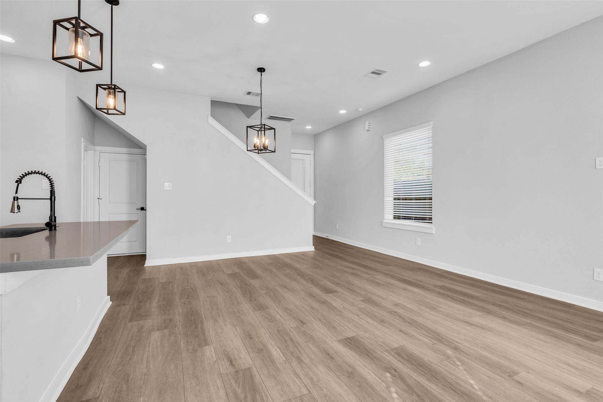 8474 Berry Green Lane, Houston, TX 77022 Room to relax and unwind, with recessed lighting and an easy flow to the stairs.
