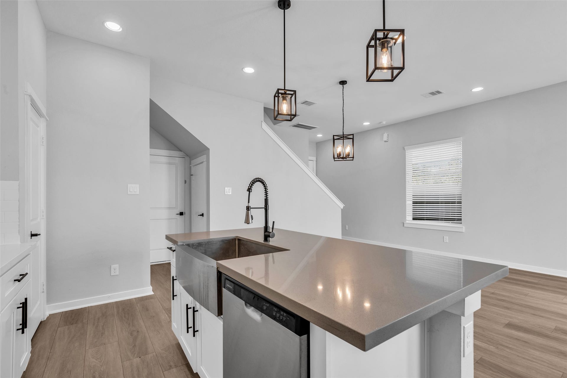 8474 Berry Green Lane, Houston, TX 77022 Clean up without missing the conversation, with the sink and dishwasher right at the island, open to the living area.