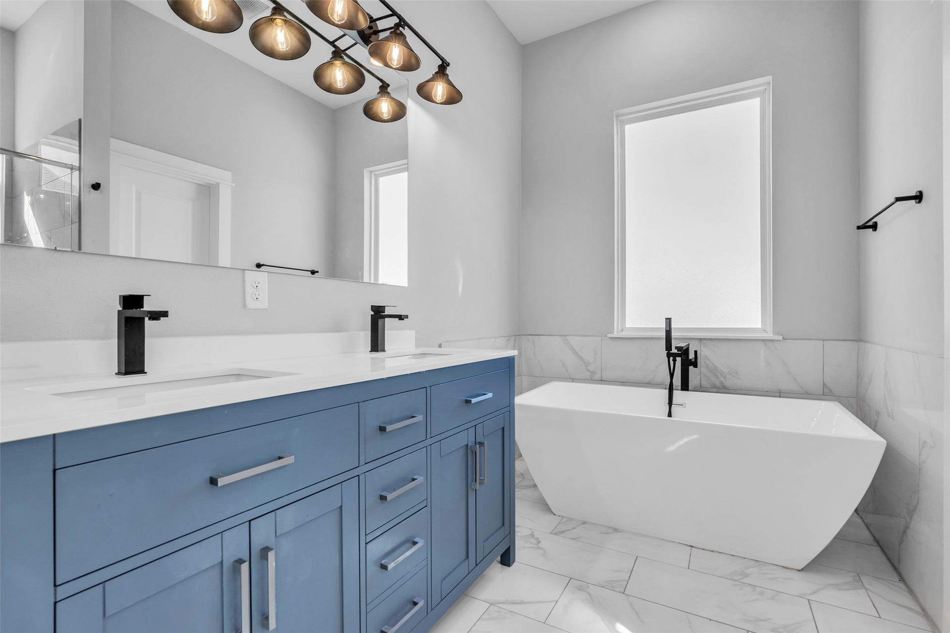 8474 Berry Green Lane, Houston, TX 77022 Unwind with a soak in the freestanding tub, and a double vanity means no waiting your turn in the morning.
