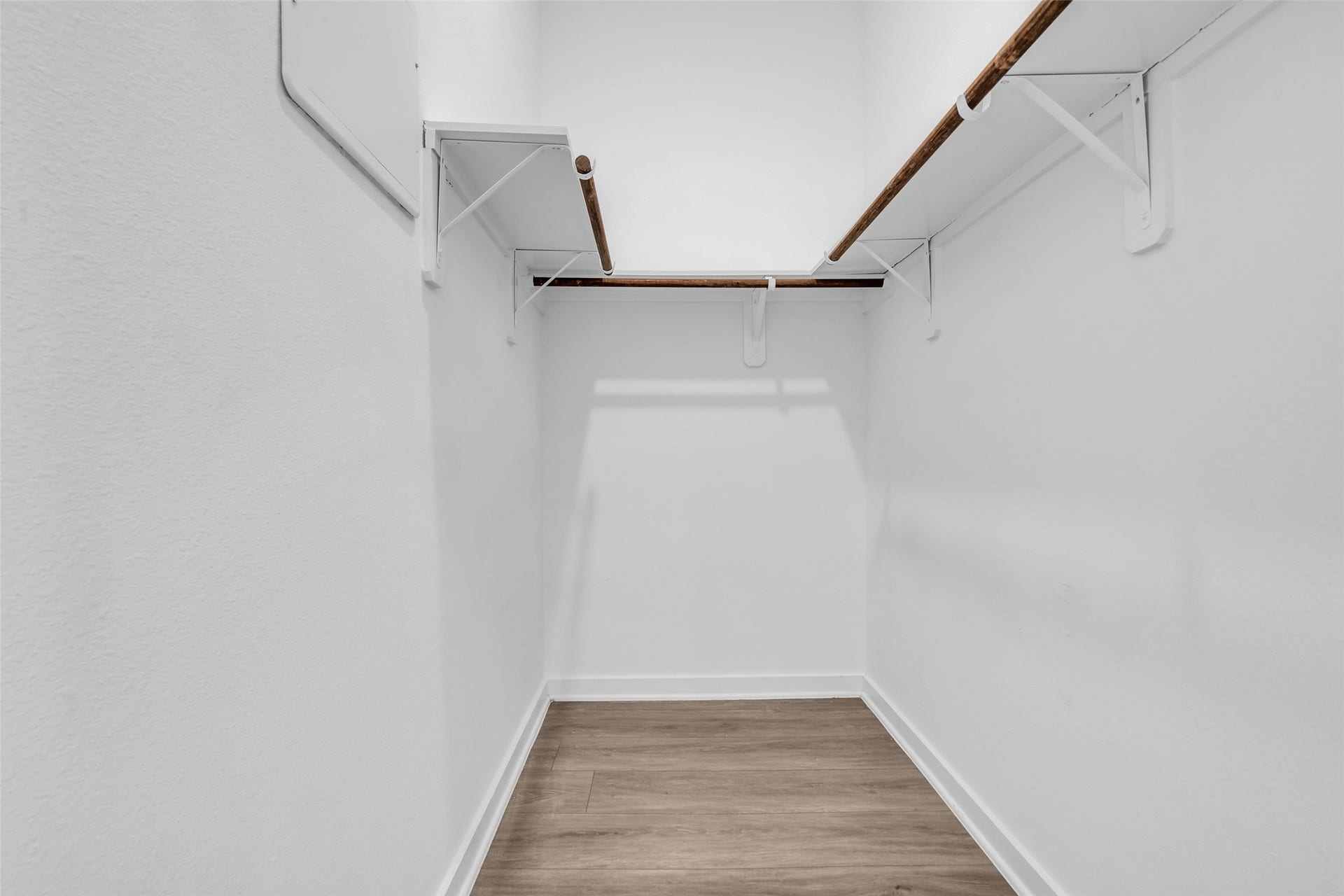 8474 Berry Green Lane, Houston, TX 77022 A walk-in closet that keeps wardrobes organized and out of sight.