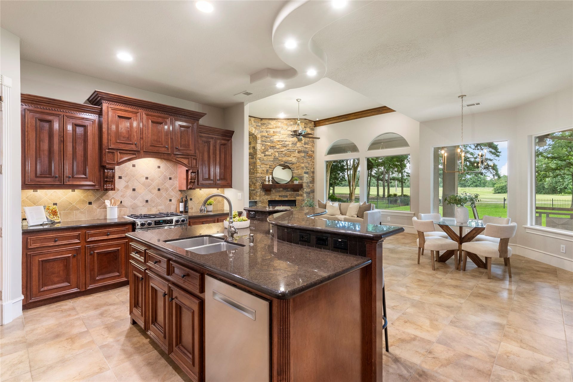 6207 Windrose Hollow Lane, Spring, TX 77379 Extensive cabinetry, double ovens, and a gas cooktop create a well planned kitchen for buyers who enjoy cooking and hosting. The space opens easily to the surrounding gathering areas for a connected lifestyle.