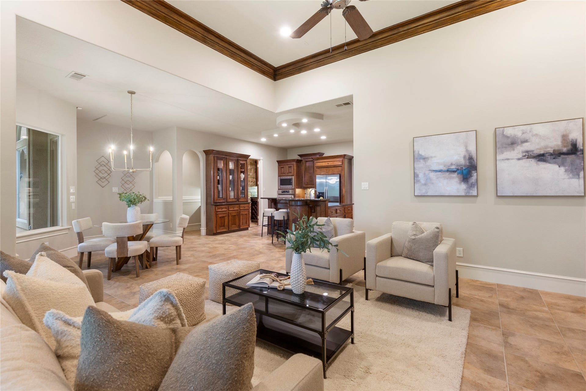 6207 Windrose Hollow Lane, Spring, TX 77379 With the ceiling detail, fireplace views, and an open connection to the kitchen, the den is designed for relaxed living without sacrificing presence. Notice the arhced walkway behind the builtin, that leads to an alcove desk space.
