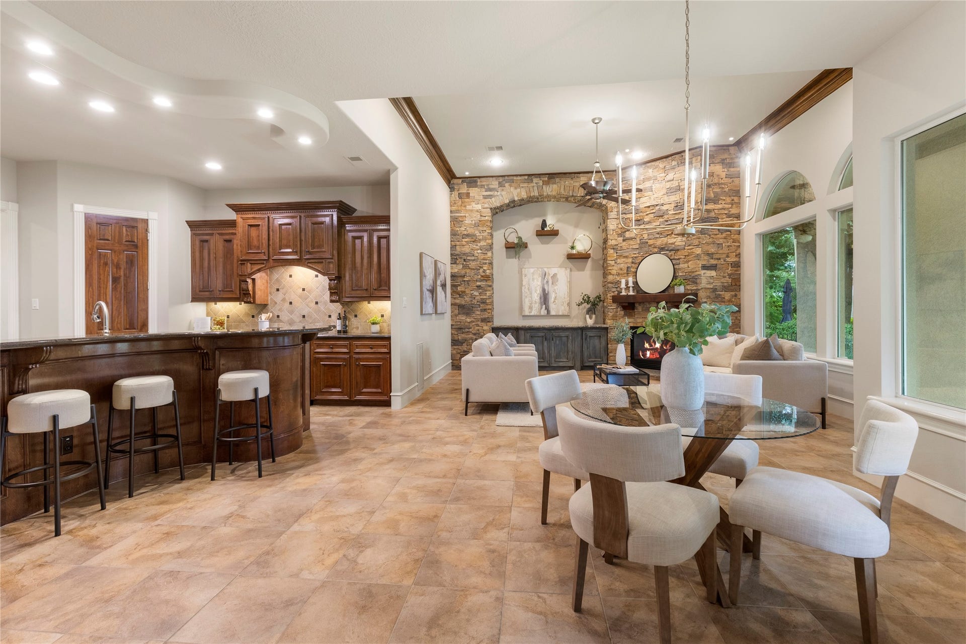 6207 Windrose Hollow Lane, Spring, TX 77379 The kitchen flows directly into the den, allowing the heart of the home to function beautifully for gatherings and daily routines. Large windows keep the outdoor views present throughout the main living area.