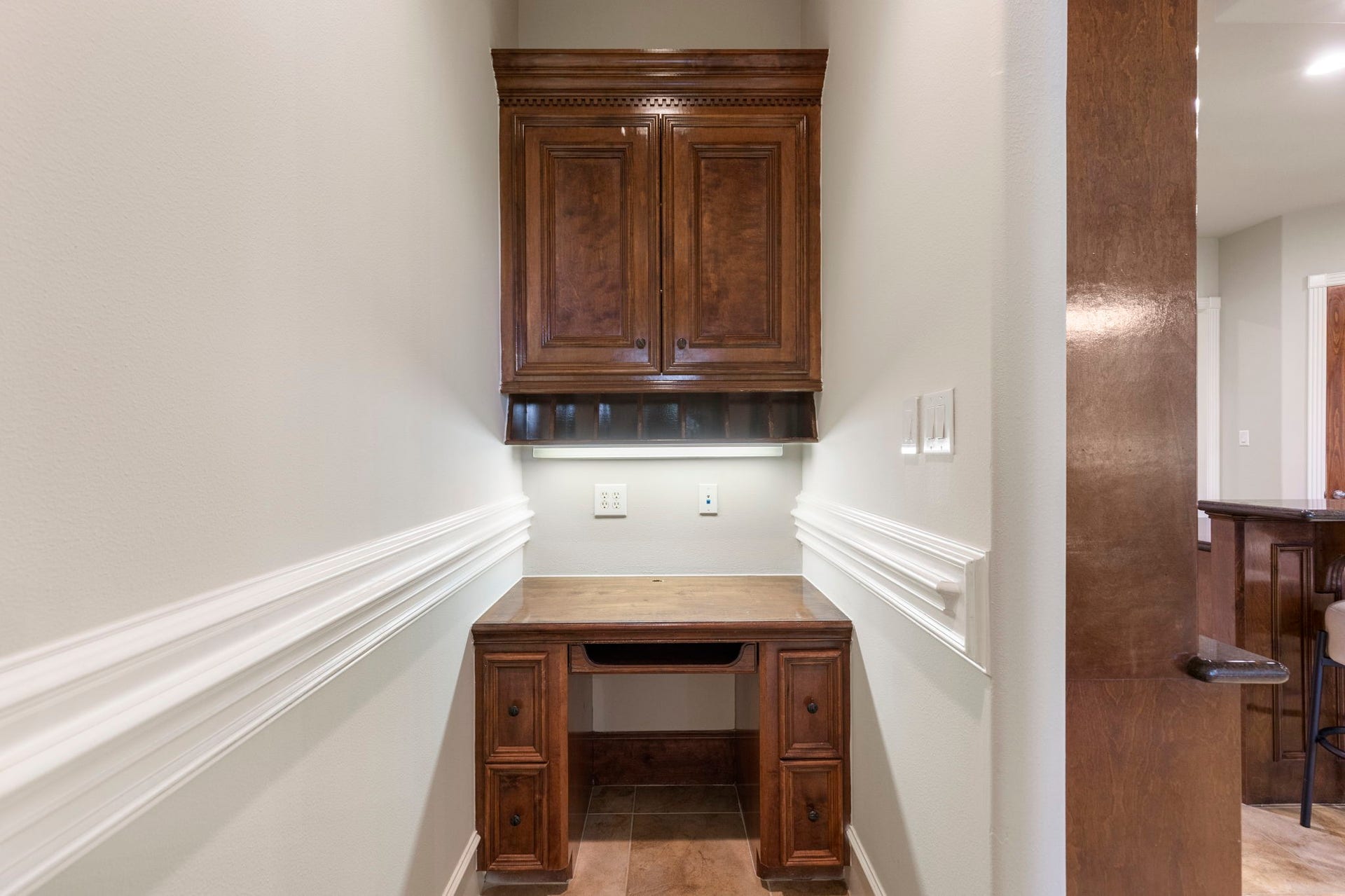 6207 Windrose Hollow Lane, Spring, TX 77379 A dedicated desk space near the kitchen adds practical storage and prep space for everyday convenience. This thoughtful detail supports the needs of a busy household.