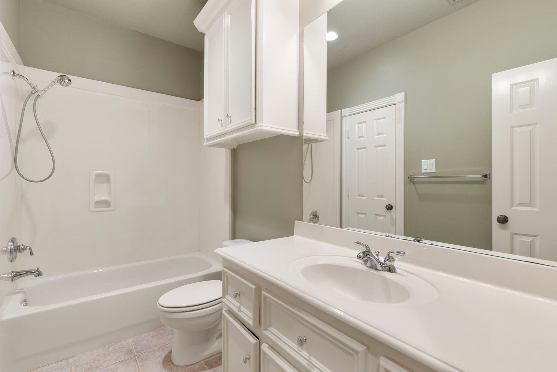 6207 Windrose Hollow Lane, Spring, TX 77379 This bath view shows a tub and shower combination with convenient vanity space.