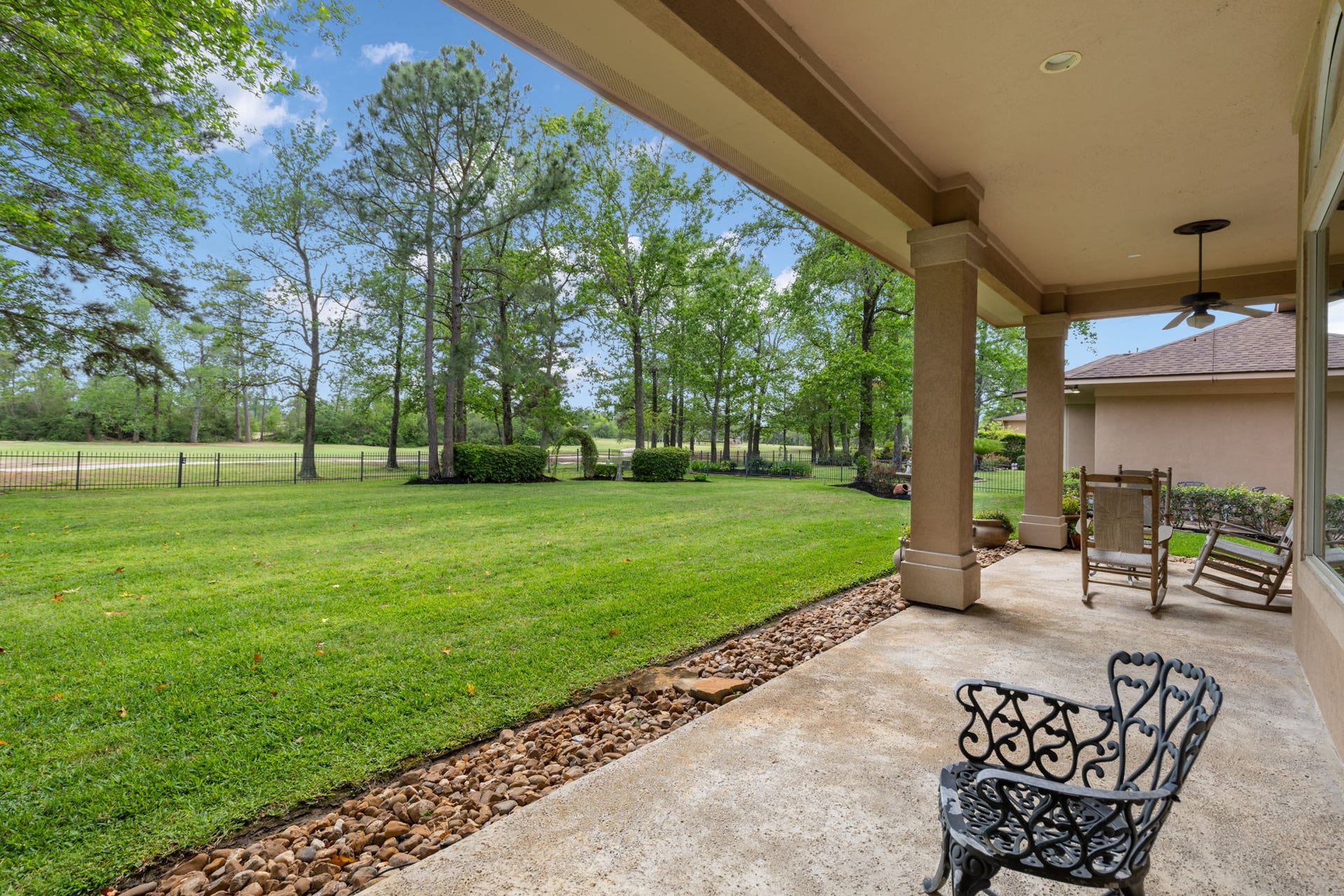 6207 Windrose Hollow Lane, Spring, TX 77379 Another patio view shows the depth of the backyard and the open green space beyond. It is ideal for buyers who want privacy, scenery, and room to enjoy the outdoors.