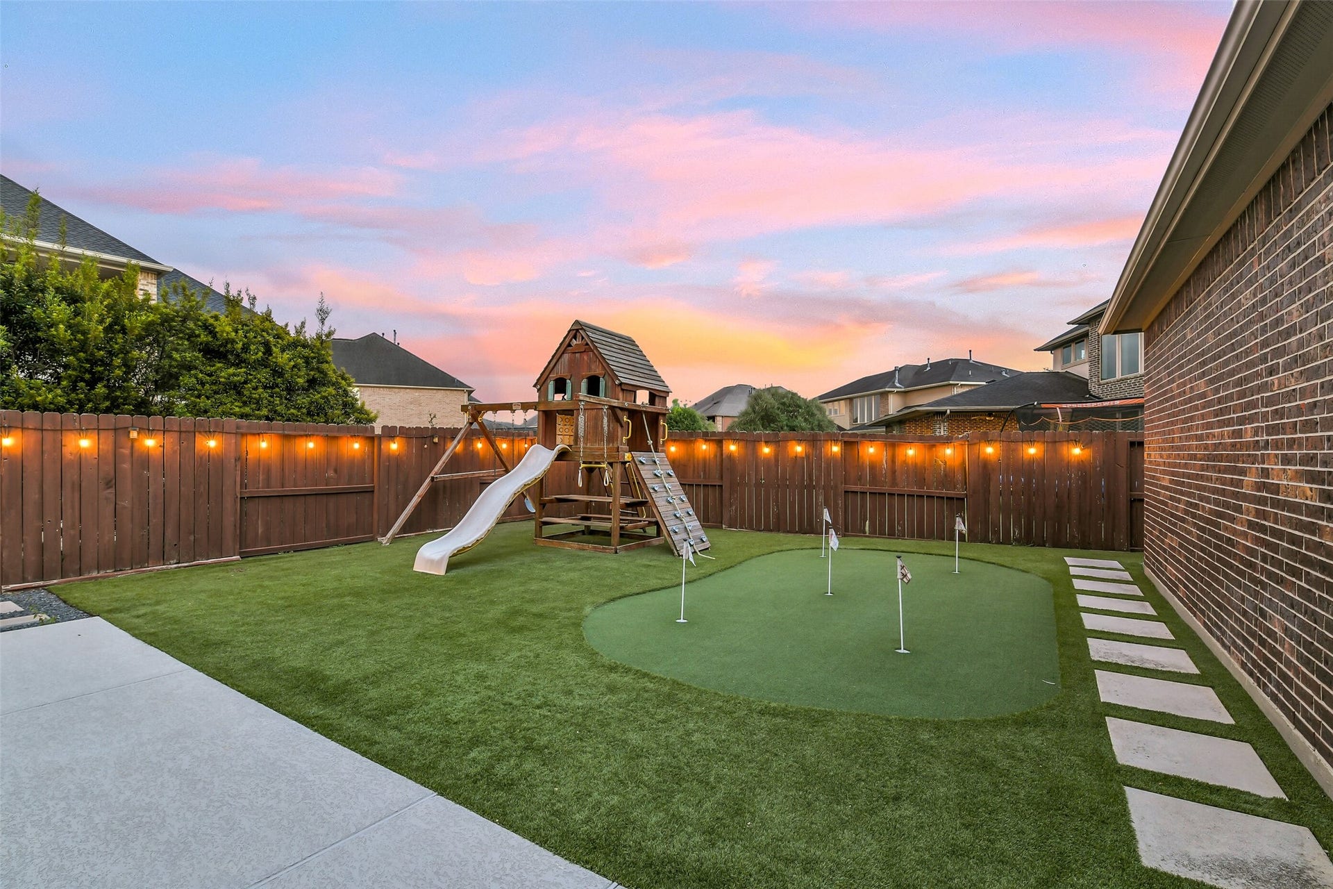 5410 Briarcliff Lane, Fulshear, TX 77441 Enjoy your very own custom putting green and expansive green space for recreation, play, and pets