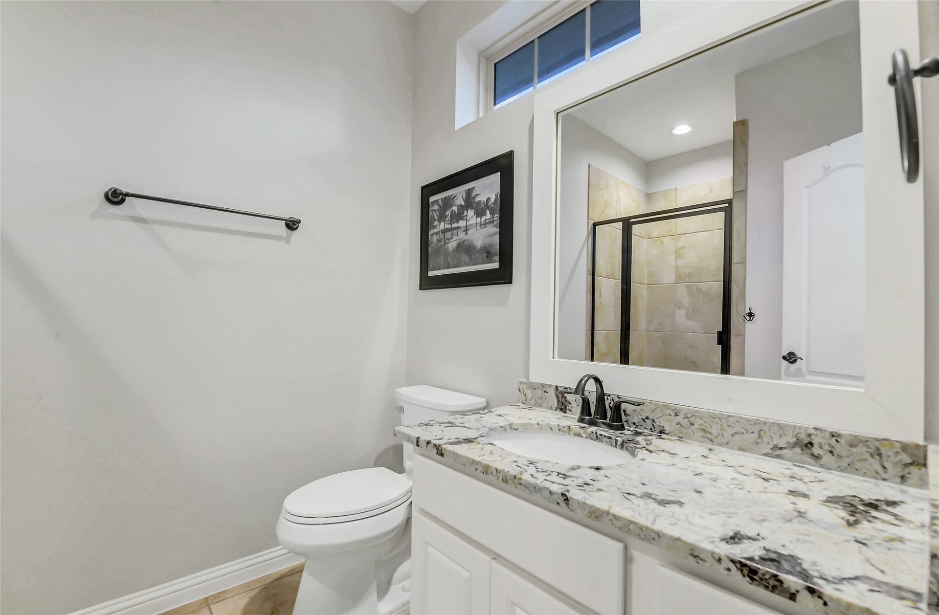 5410 Briarcliff Lane, Fulshear, TX 77441 Upstairs ensuite bathroom features a granite vanity, a spacious walk-in shower with tile surround, glass enclosure and elevated finishes.
