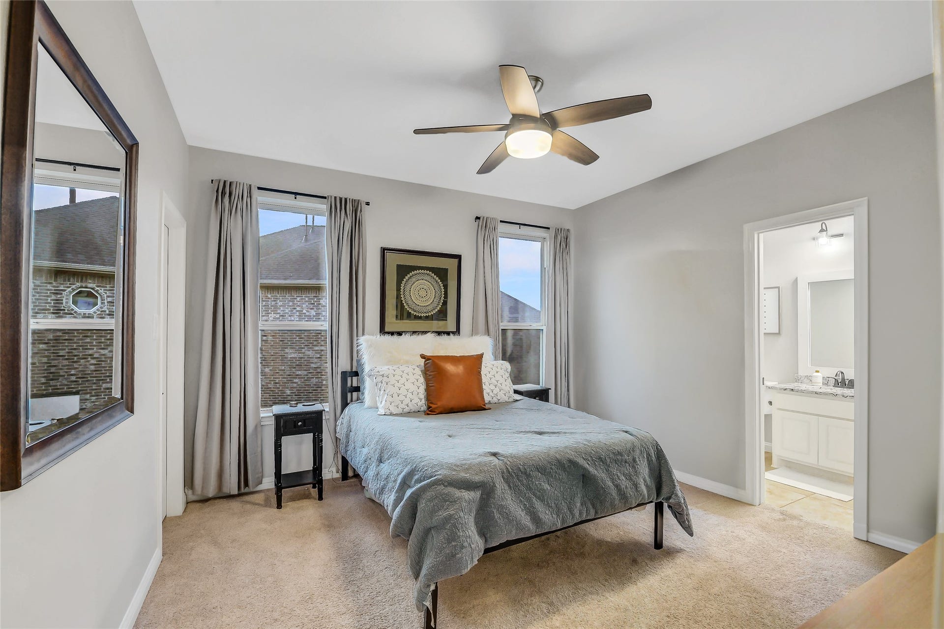 5410 Briarcliff Lane, Fulshear, TX 77441 Secondary bedroom upstairs with dual windows, walk-in closet and ensuite bathroom.
