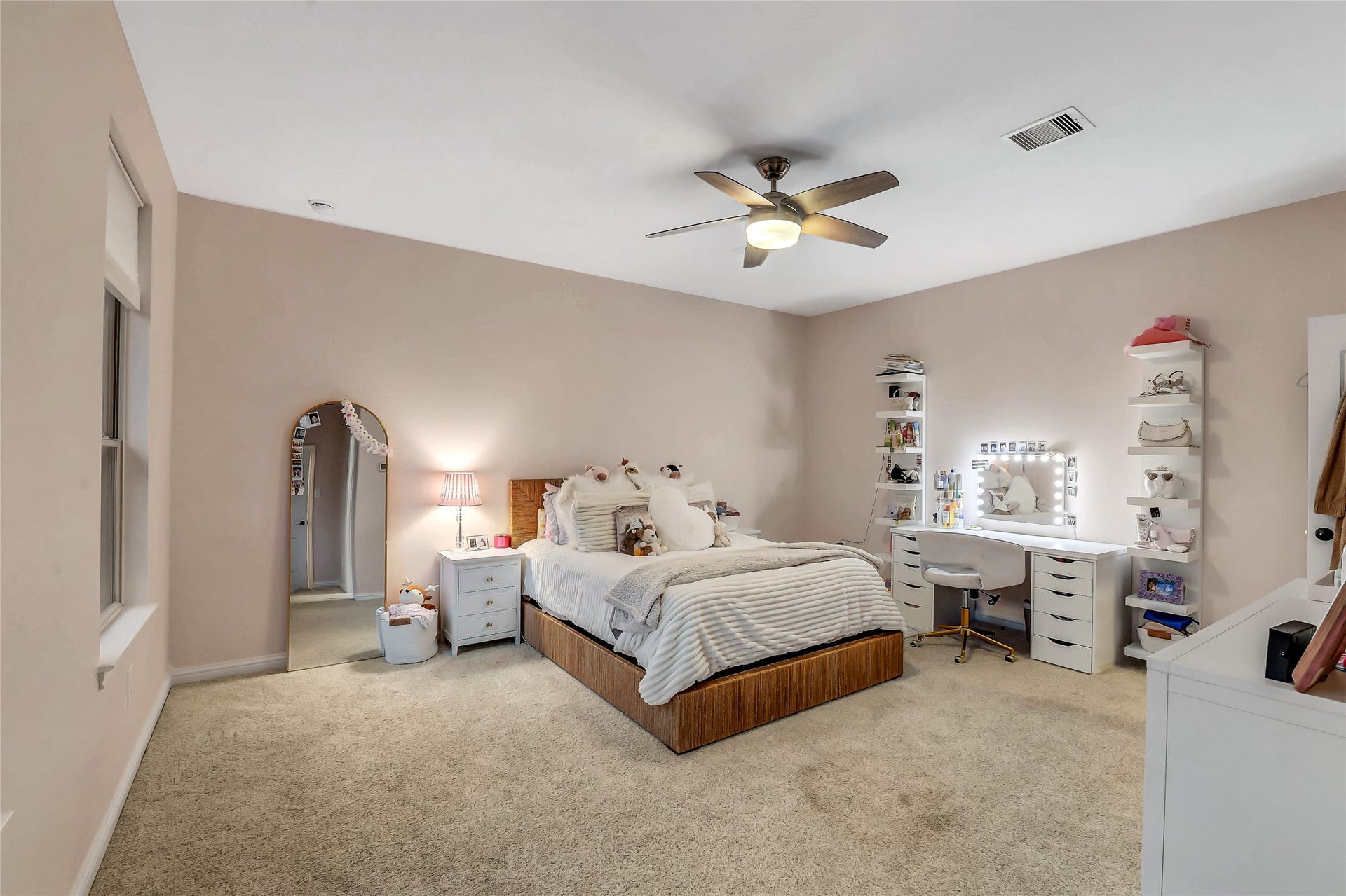 5410 Briarcliff Lane, Fulshear, TX 77441 Light-filled upstairs bedroom with ample room for a sitting area or study space, plus a private ensuite bath.