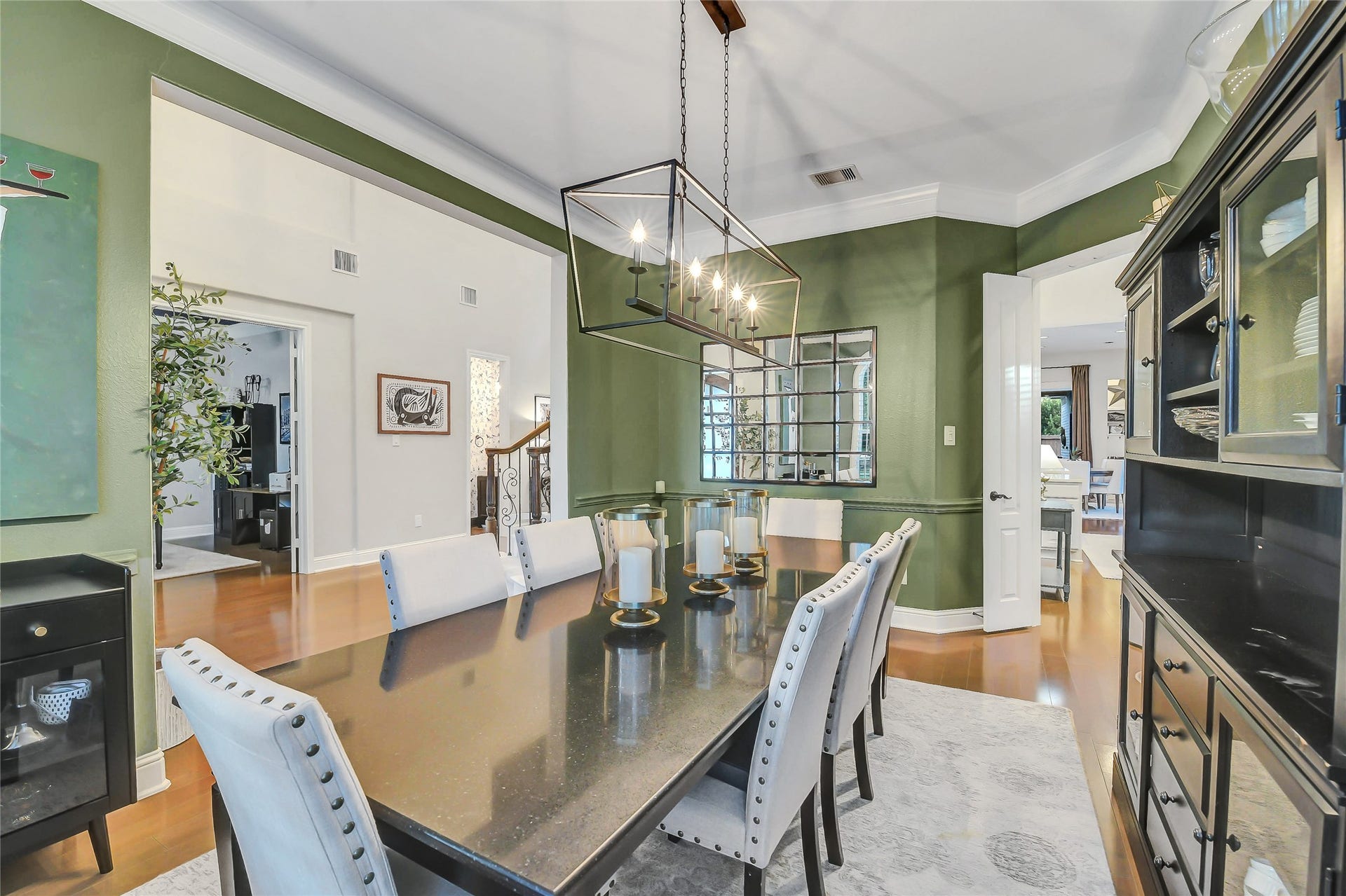 5410 Briarcliff Lane, Fulshear, TX 77441 Formal dining room open to the grand entryway and seamlessly connected to the gourmet kitchen through elegant double doors.