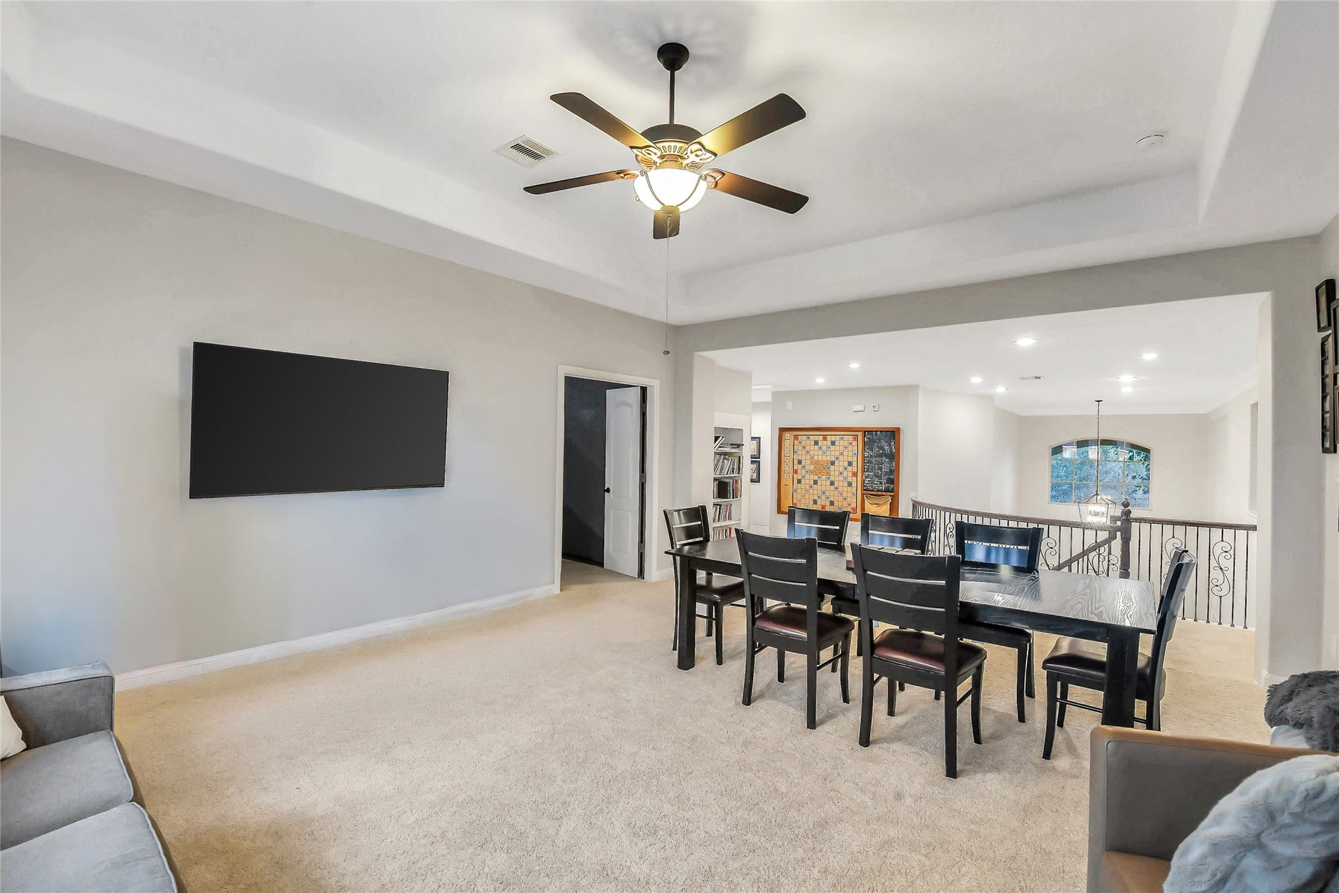 5410 Briarcliff Lane, Fulshear, TX 77441 Oversized upstairs game room with abundant natural light and room for a pool table, game tables, or lounge area.