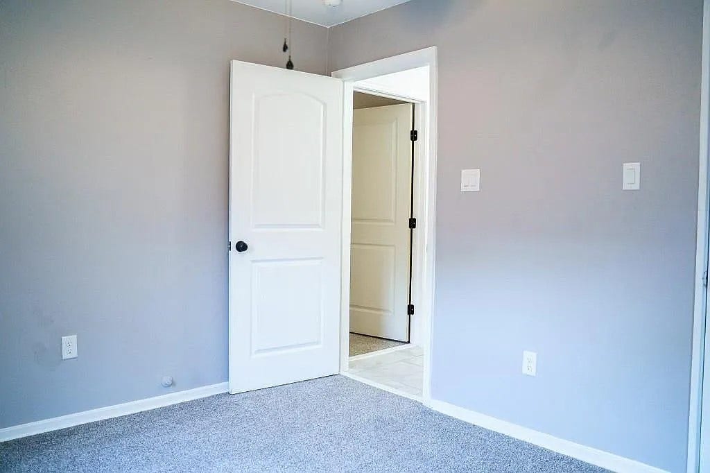 Interior Hallway with Fresh Paint and Wood-Look Flooring