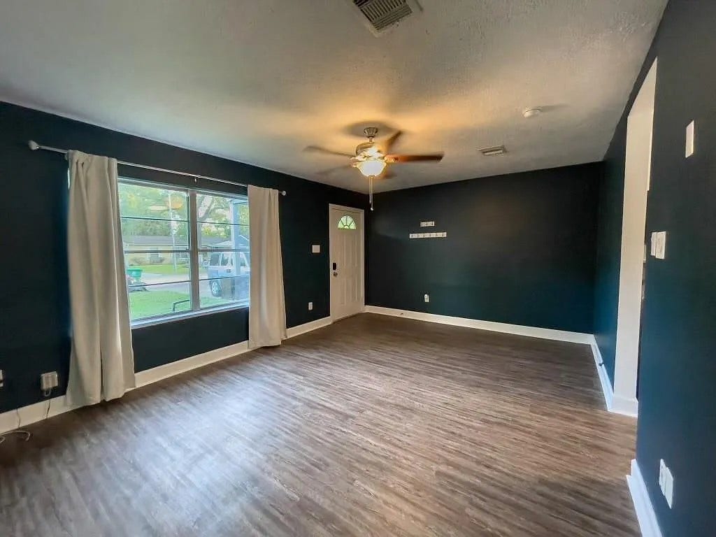 Master Bedroom with Ceiling Fan and Large Window
