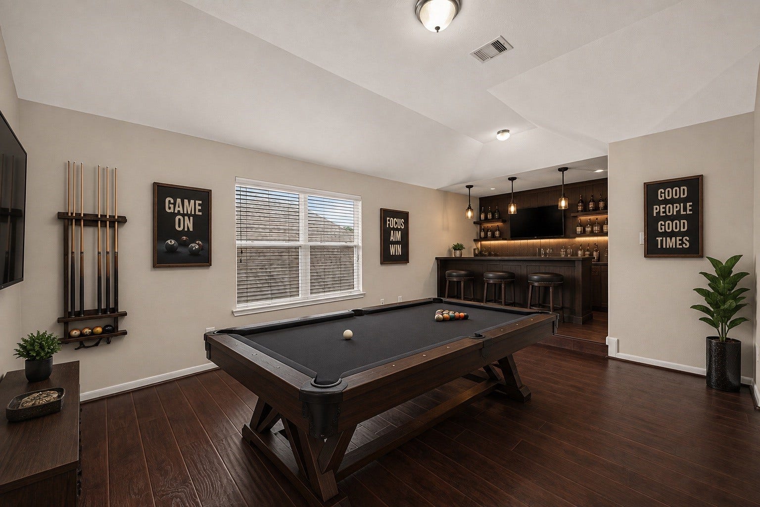 3635 Cottage Manor Lane, Katy, TX 77494 Spacious game room with a vaulted ceiling, large window, and room for a pool table, lounge area, or entertainment setup.