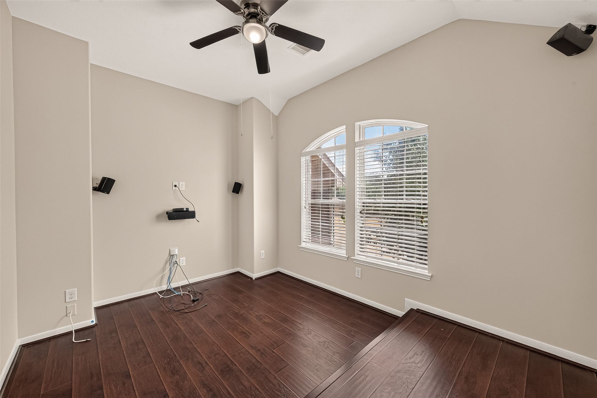 3635 Cottage Manor Lane, Katy, TX 77494 Vaulted ceiling, arched-top windows, ceiling fan, and a raised platform area make this a great media room, office, or bedroom.