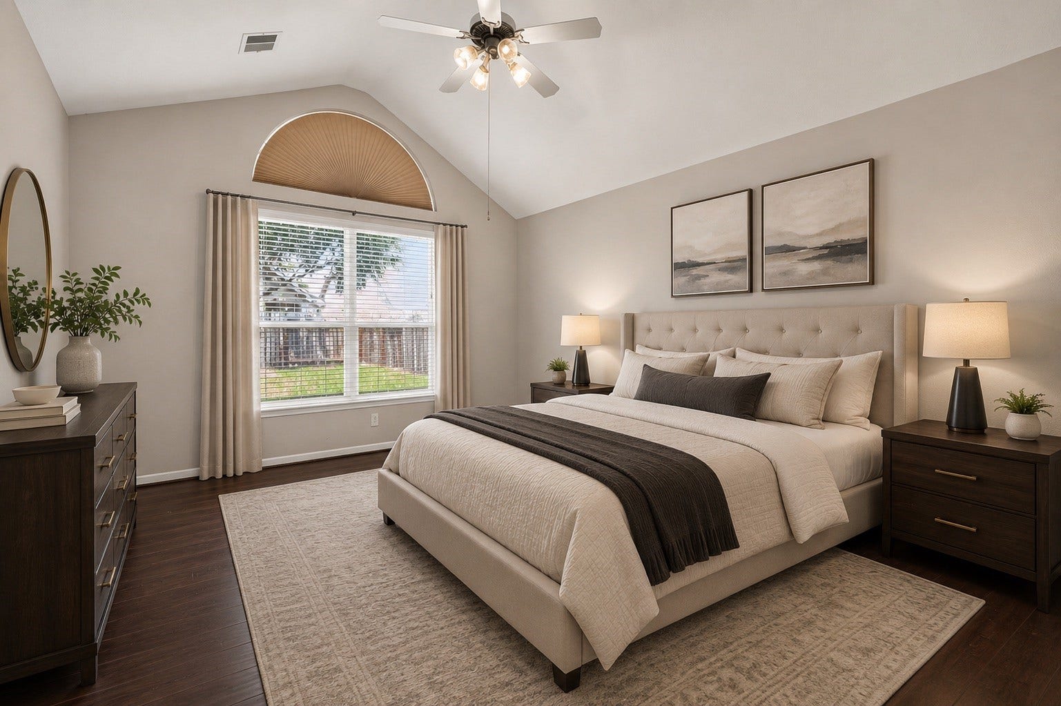 3635 Cottage Manor Lane, Katy, TX 77494 Vaulted ceiling, arched window with backyard views, ceiling fan, and rich wood-look flooring create a calm retreat.