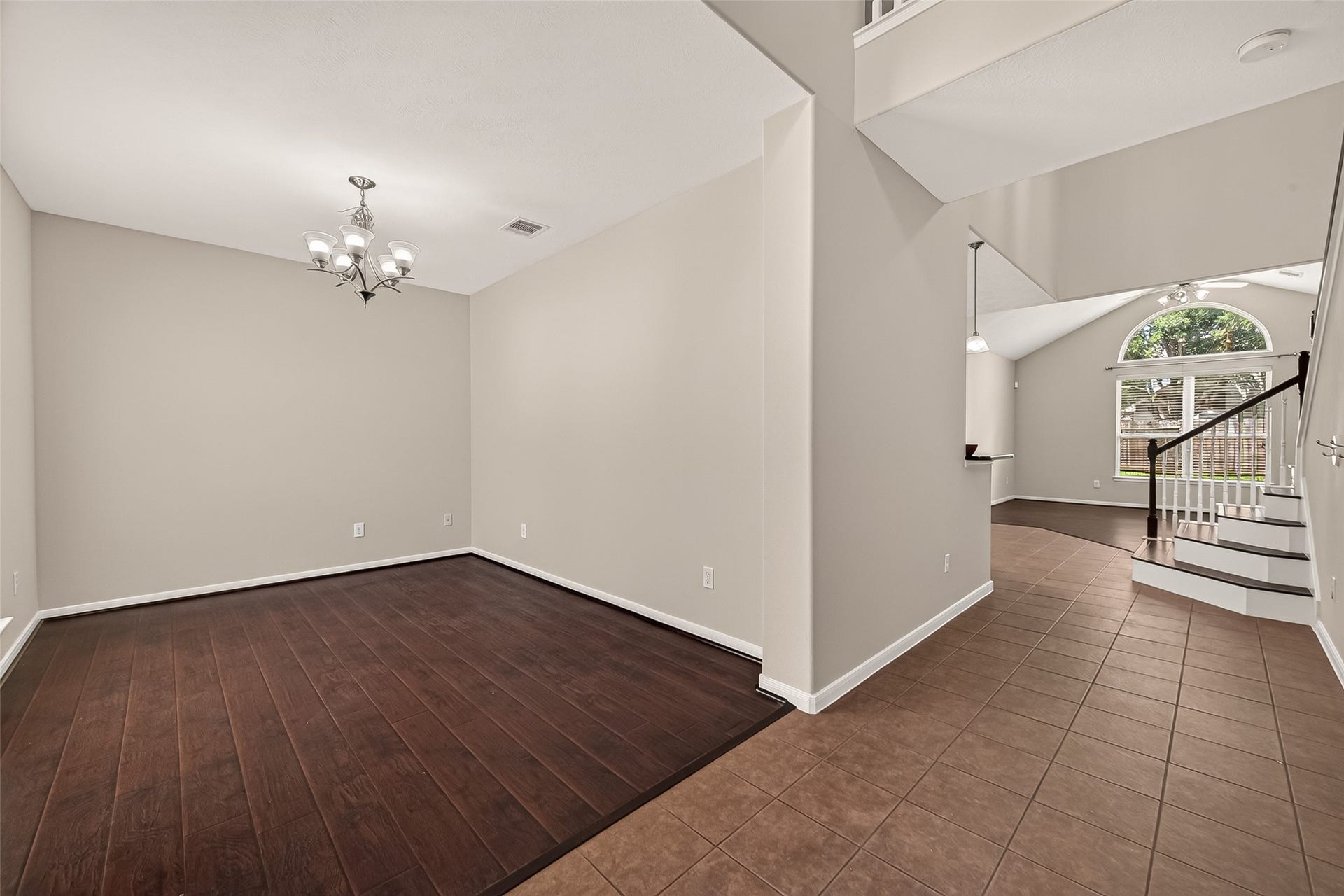 3635 Cottage Manor Lane, Katy, TX 77494 Formal dining room with a view across the entry to the staircase and the vaulted living room beyond.