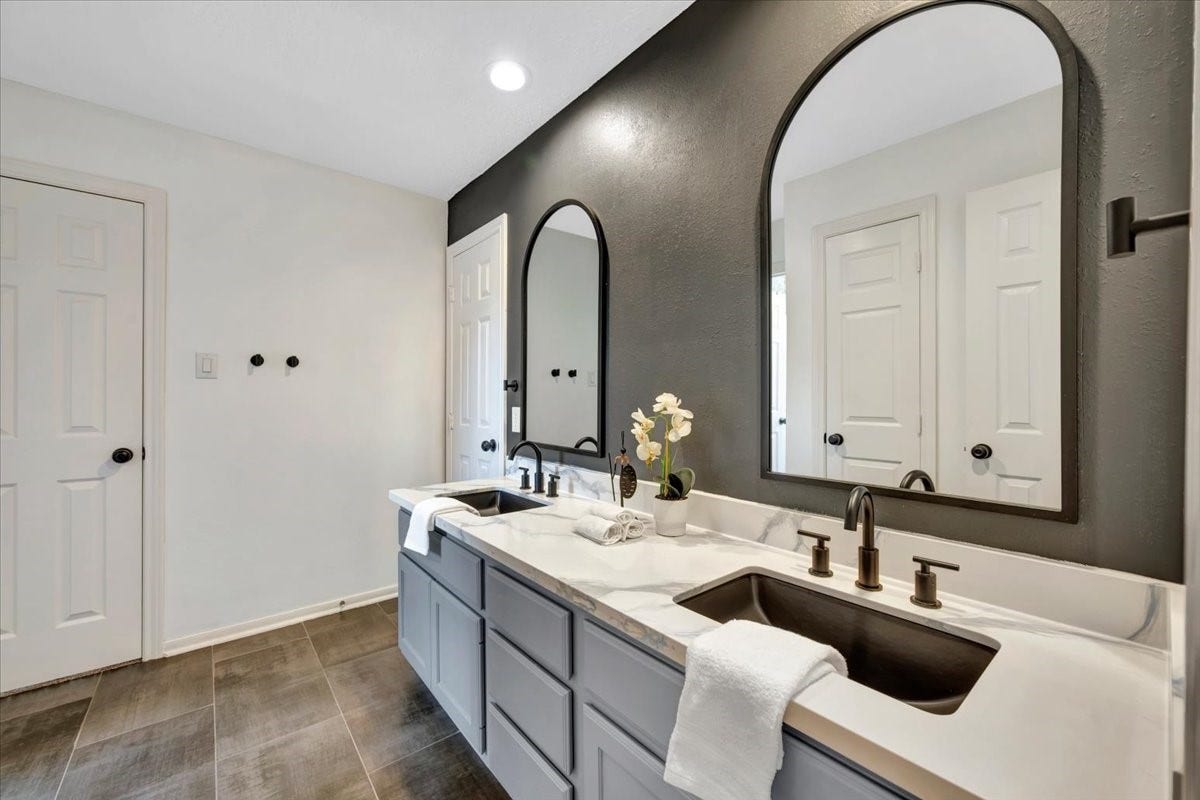 Upstairs full bathroom with dual-sink vanity area.