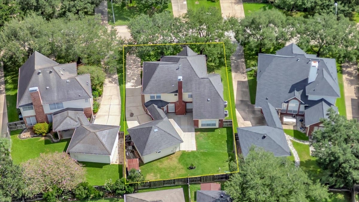 Birds-eye view showcasing the homes impressive setting, spacious backyard - ready for its new owners.