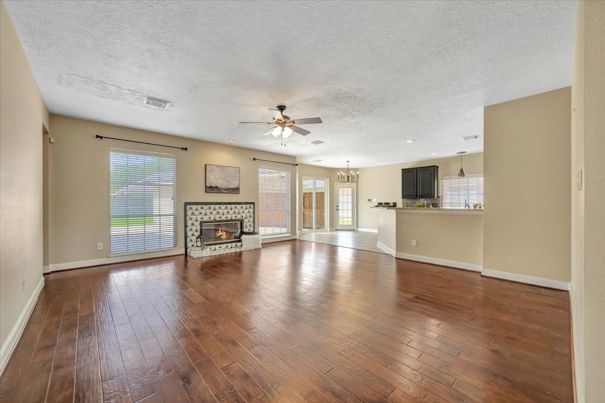 Bright, open two-story entry flows seamlessly into the expansive living room beyond.