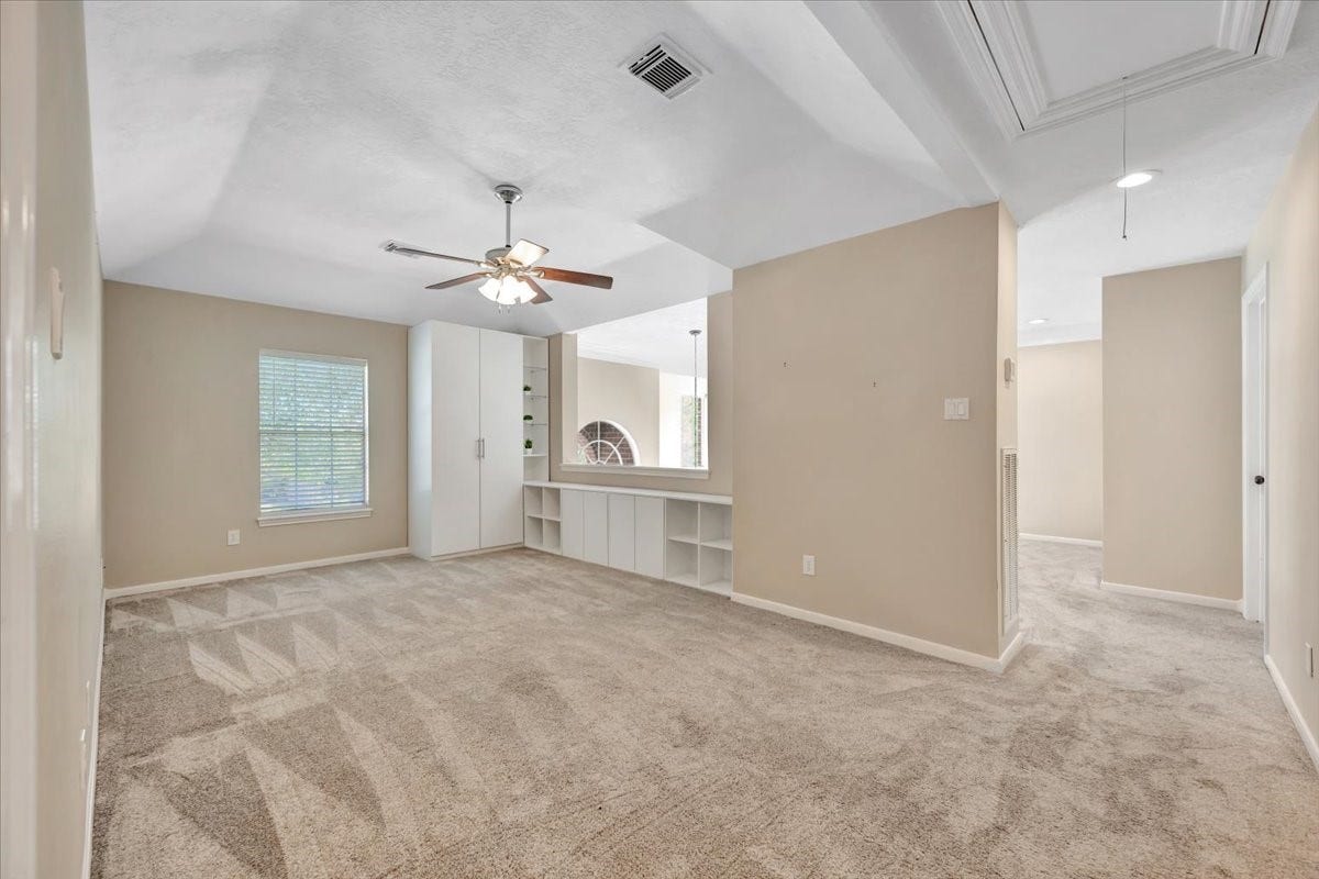 Upstairs game room offering flexible space for work, play, or media.