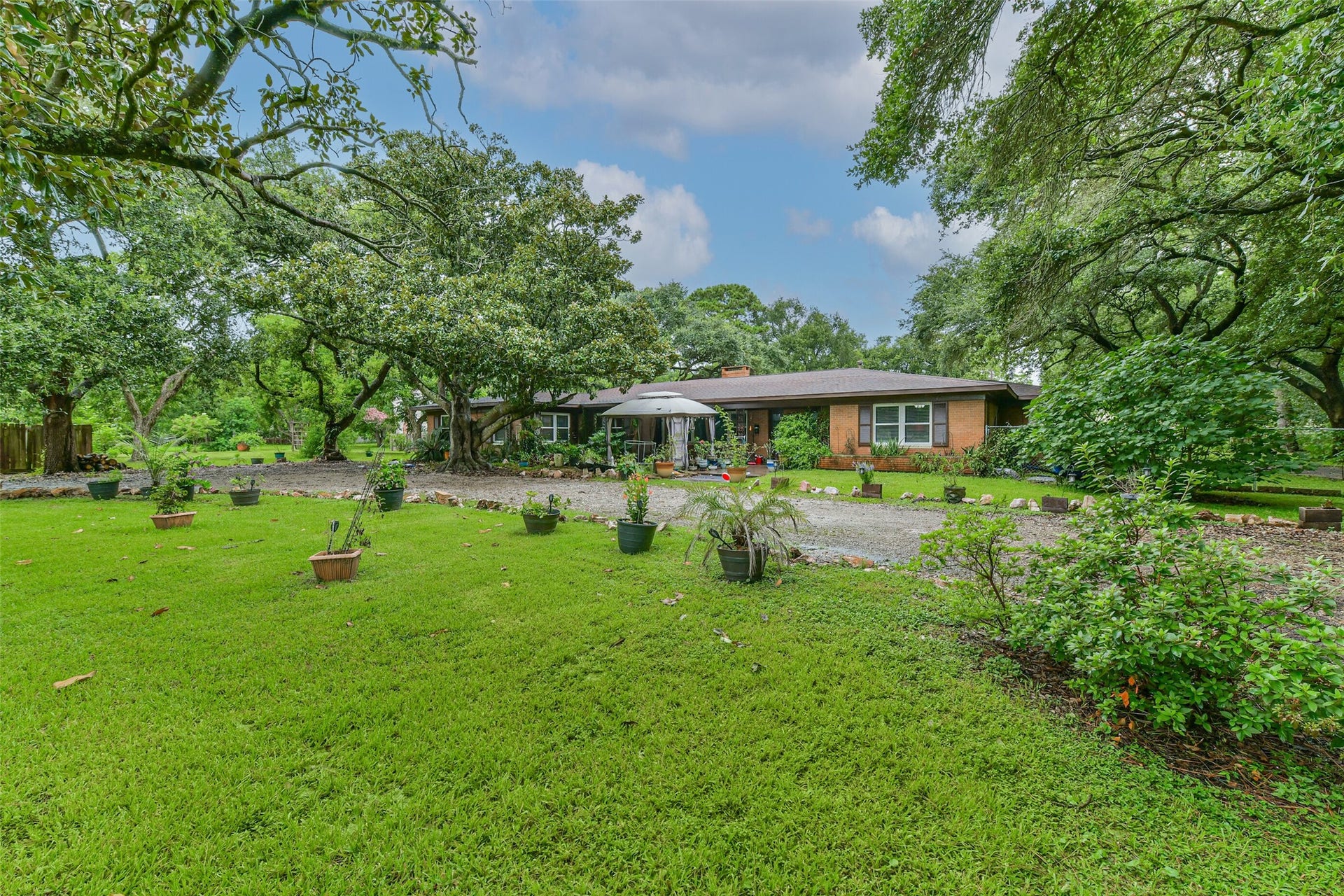 623 Laurel Street, La Marque, TX 77568 Circular drive coming up to the entrance of the home. The patio cover is damaged so will be removed and entrance opened up.
