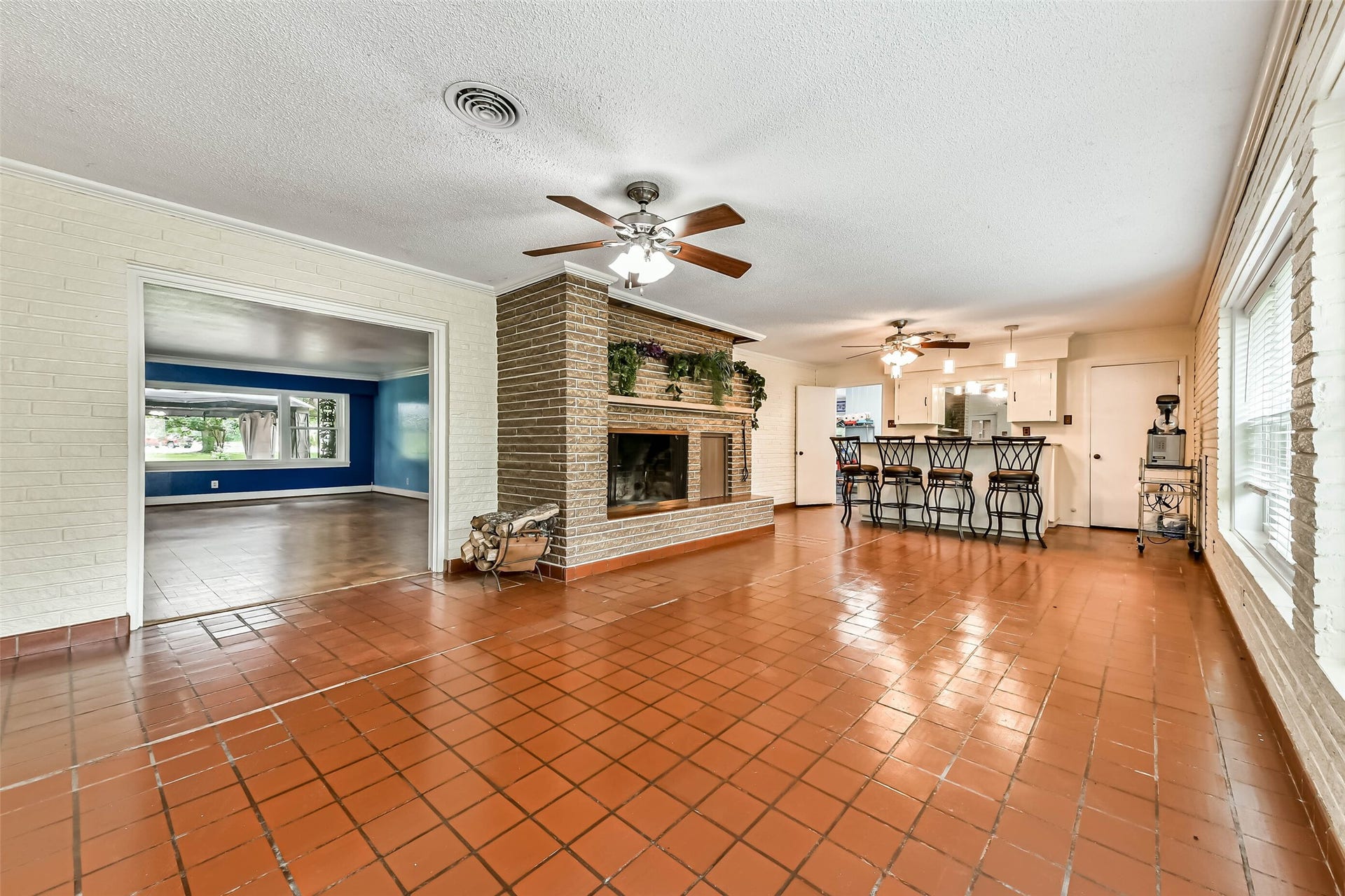 623 Laurel Street, La Marque, TX 77568 Large Sunroom is the same length as the formal living and dining room. Brick built-in Fireplace with lighting and a planter. Bar at the end stays as well as the barstools. However the seller will be retaining the marguerite machine. All new windows throughout the home