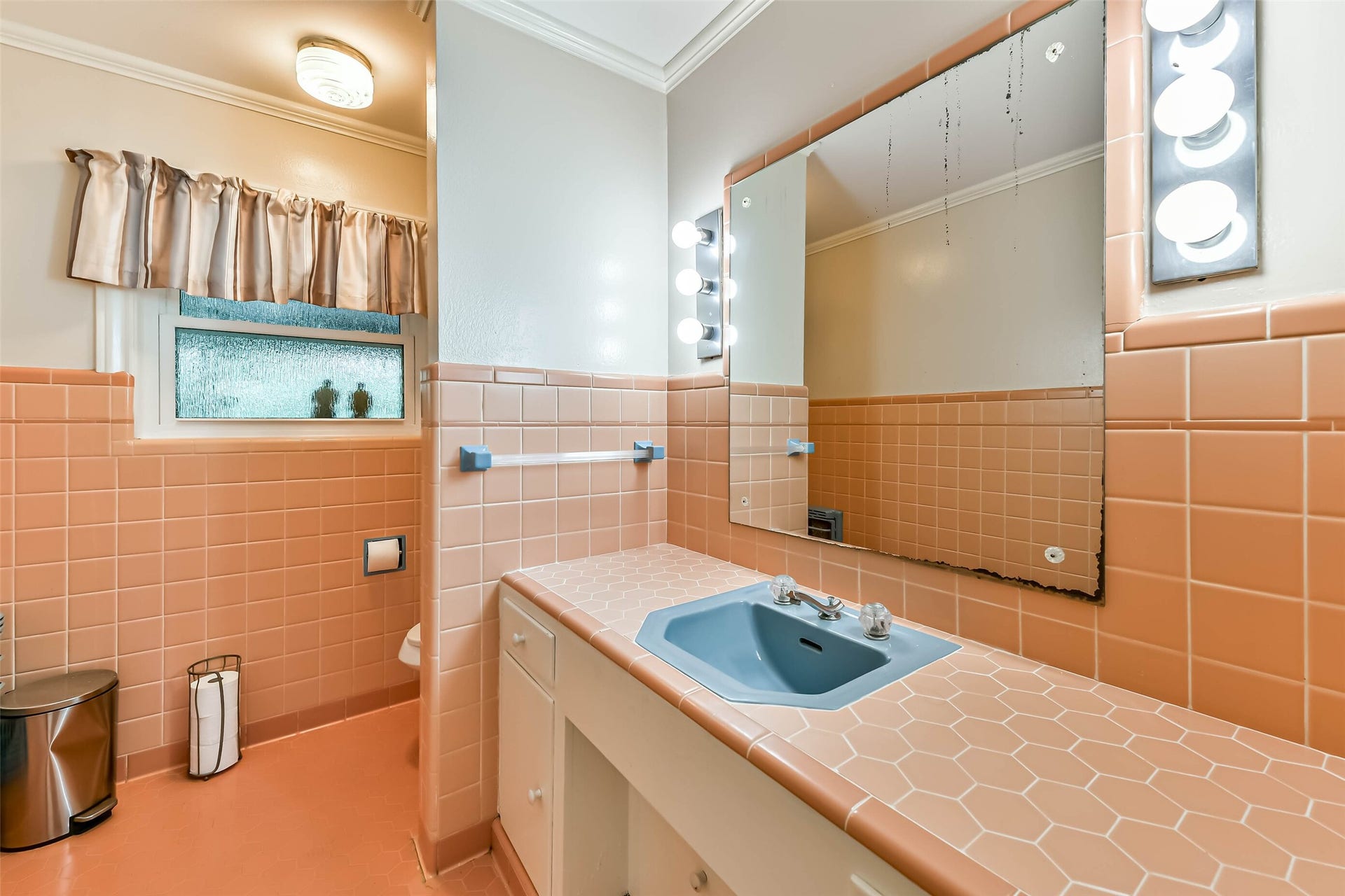 623 Laurel Street, La Marque, TX 77568 In the same hallway and right next to each other is an additional half bath with double vanity, storage, and toiler. Mirror is being replaced just didn't get it done in time before pictures.