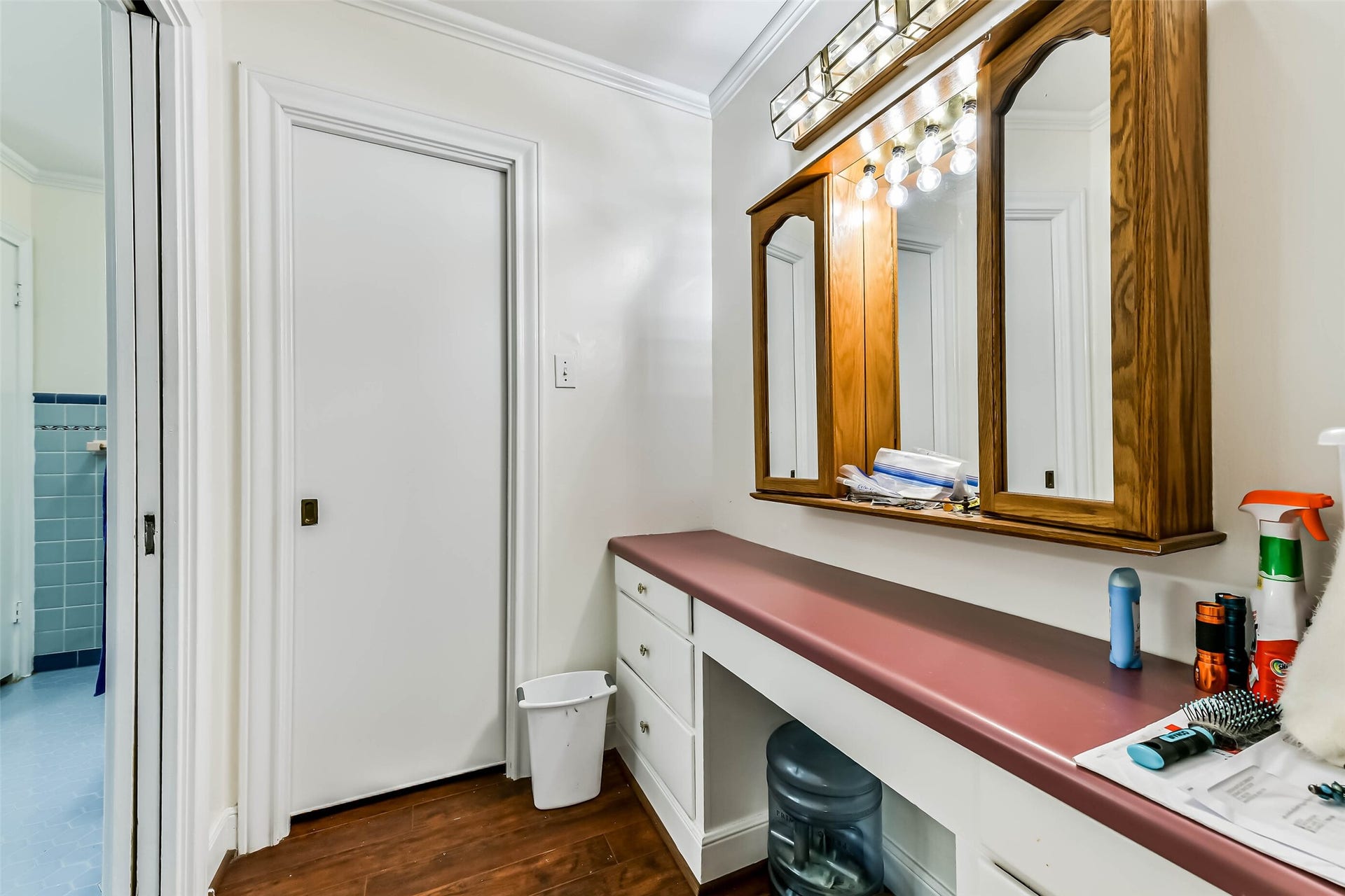 623 Laurel Street, La Marque, TX 77568 Nice long cabinet and counter for getting ready with another closet, door to left leads to the remaining master bath