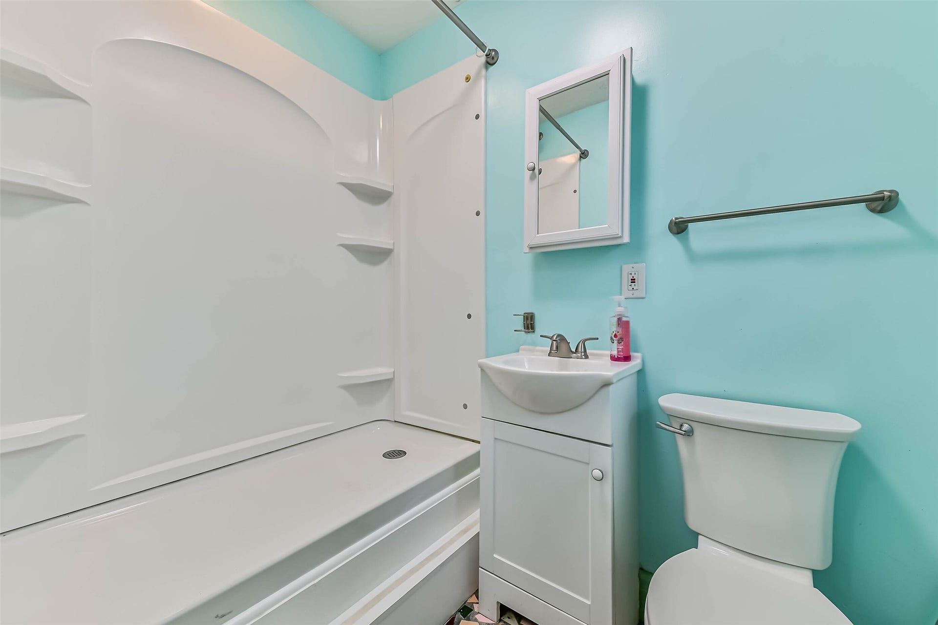 623 Laurel Street, La Marque, TX 77568 Step up shower with small sink and toilet for garage conversion.