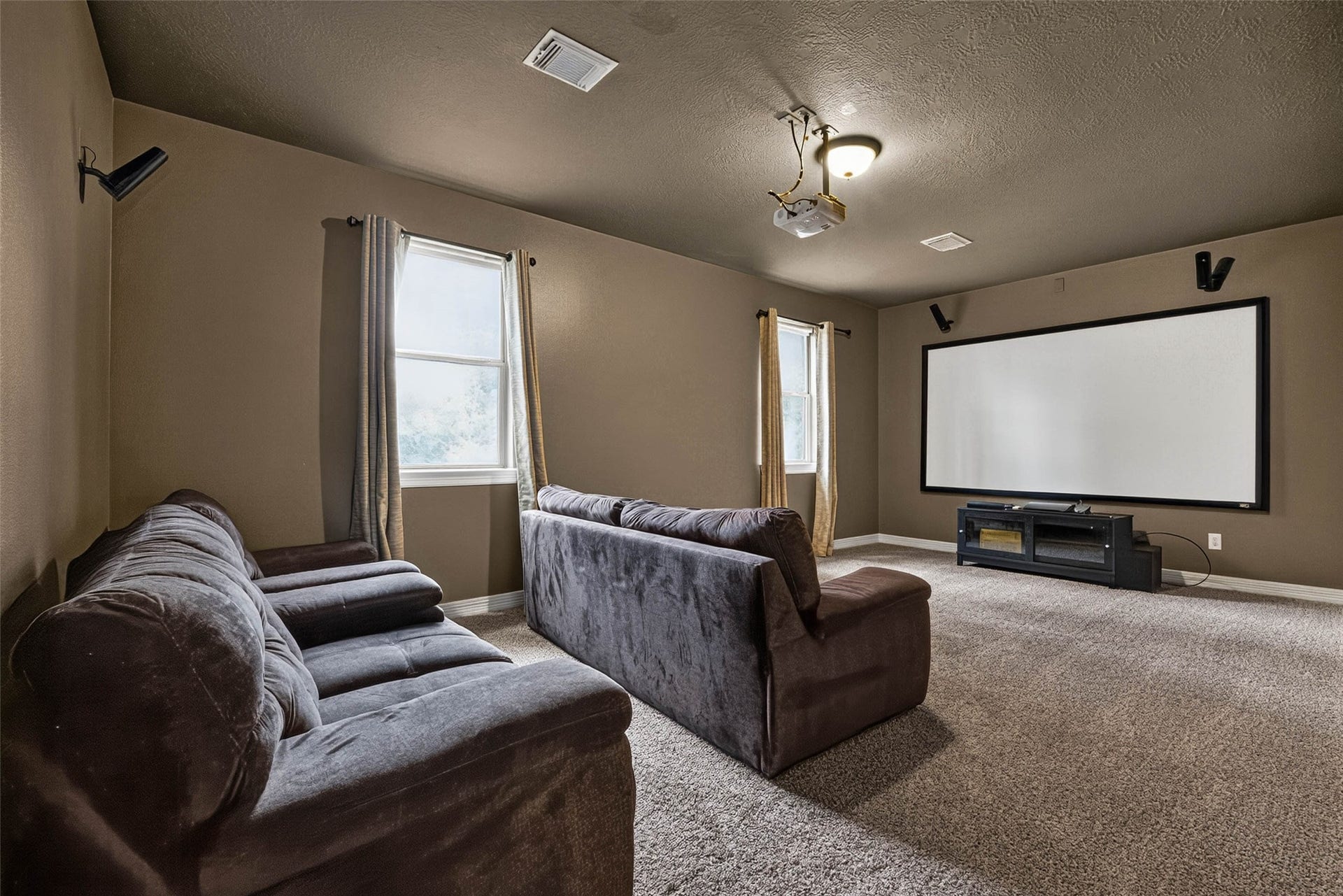 12455 Cedar Breaks Court, Humble, TX 77346 This media room large and the perfect place to enjoy movies or sports. The projector screen and equipment are included!
