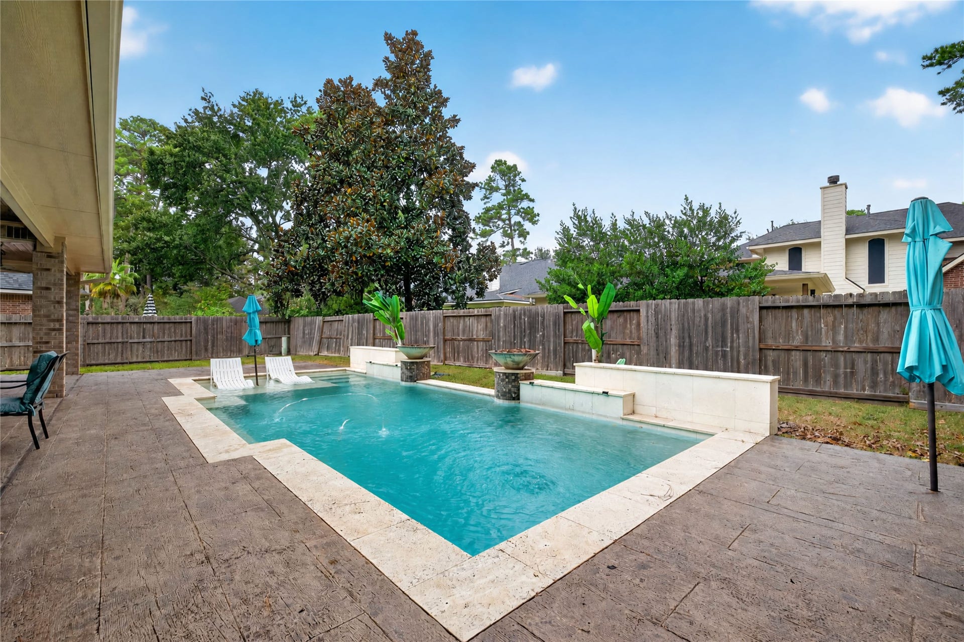 12455 Cedar Breaks Court, Humble, TX 77346 This modern pool with sun ledge is less than 10 years old.