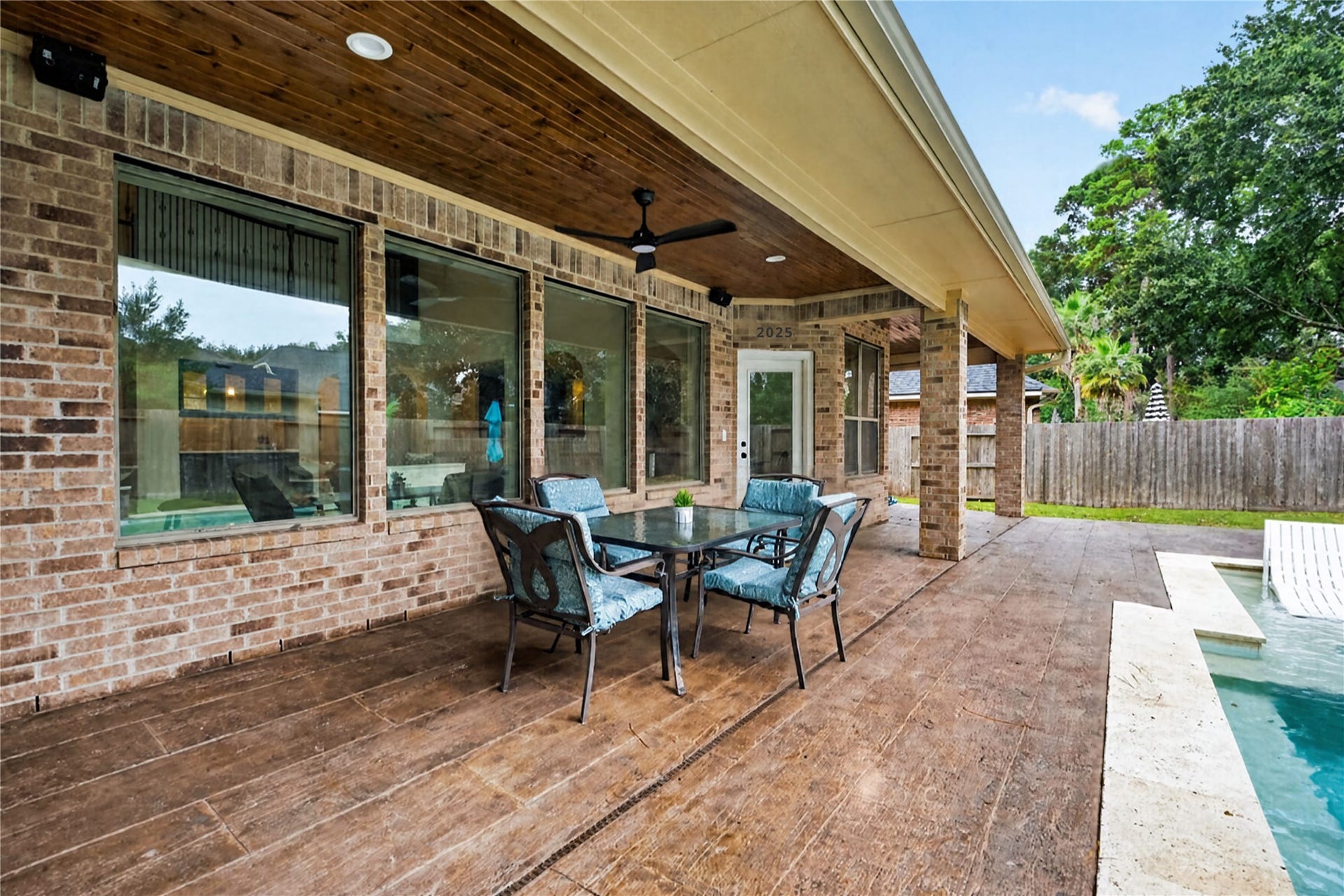 12455 Cedar Breaks Court, Humble, TX 77346 Custom covered back patio with tile flooring makes for easy cleaning & fun entertaining year-round.