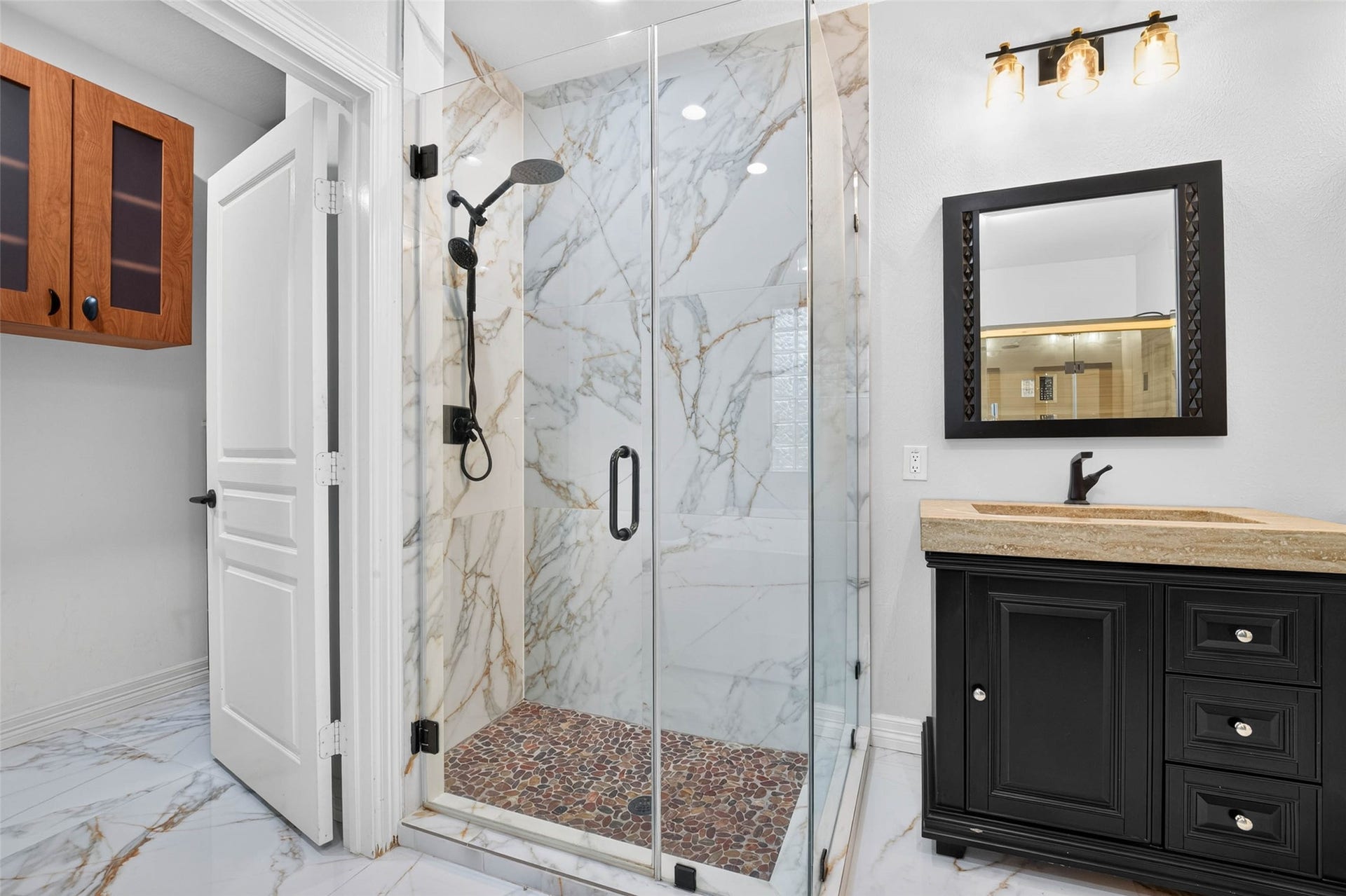 12455 Cedar Breaks Court, Humble, TX 77346 Separate remodeled shower with frameless glass shower door.