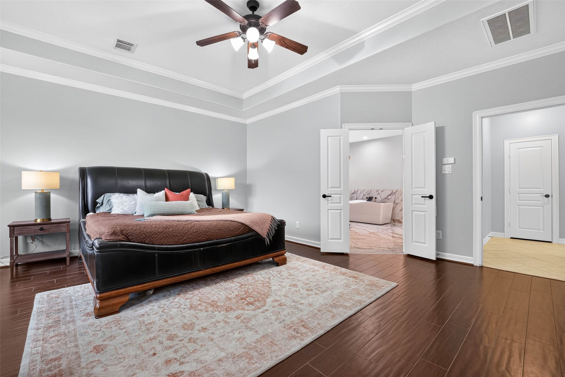 12455 Cedar Breaks Court, Humble, TX 77346 Primary Bedroom with wood-look tile flooring.