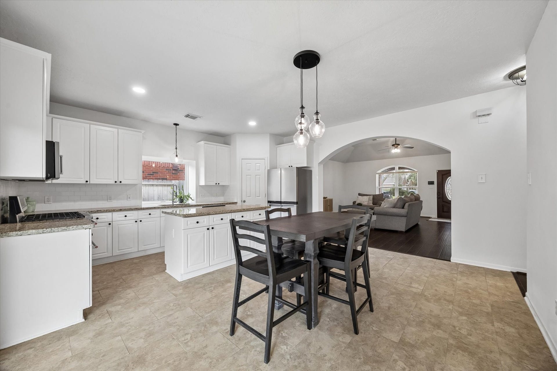 Dining and kitchen spaces connect seamlessly for an open, functional layout.
