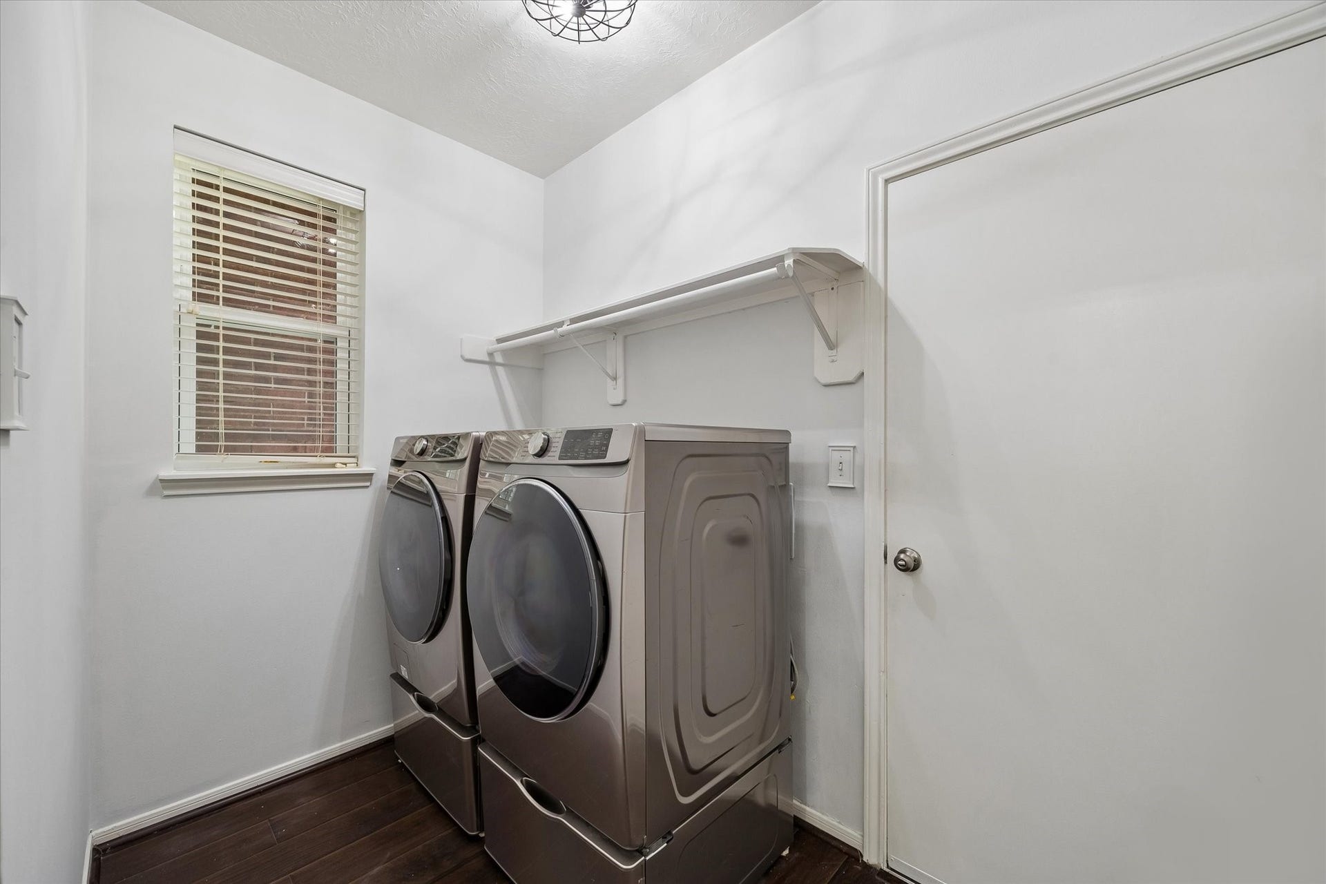 Dedicated laundry room with washer and dryer included with the home.